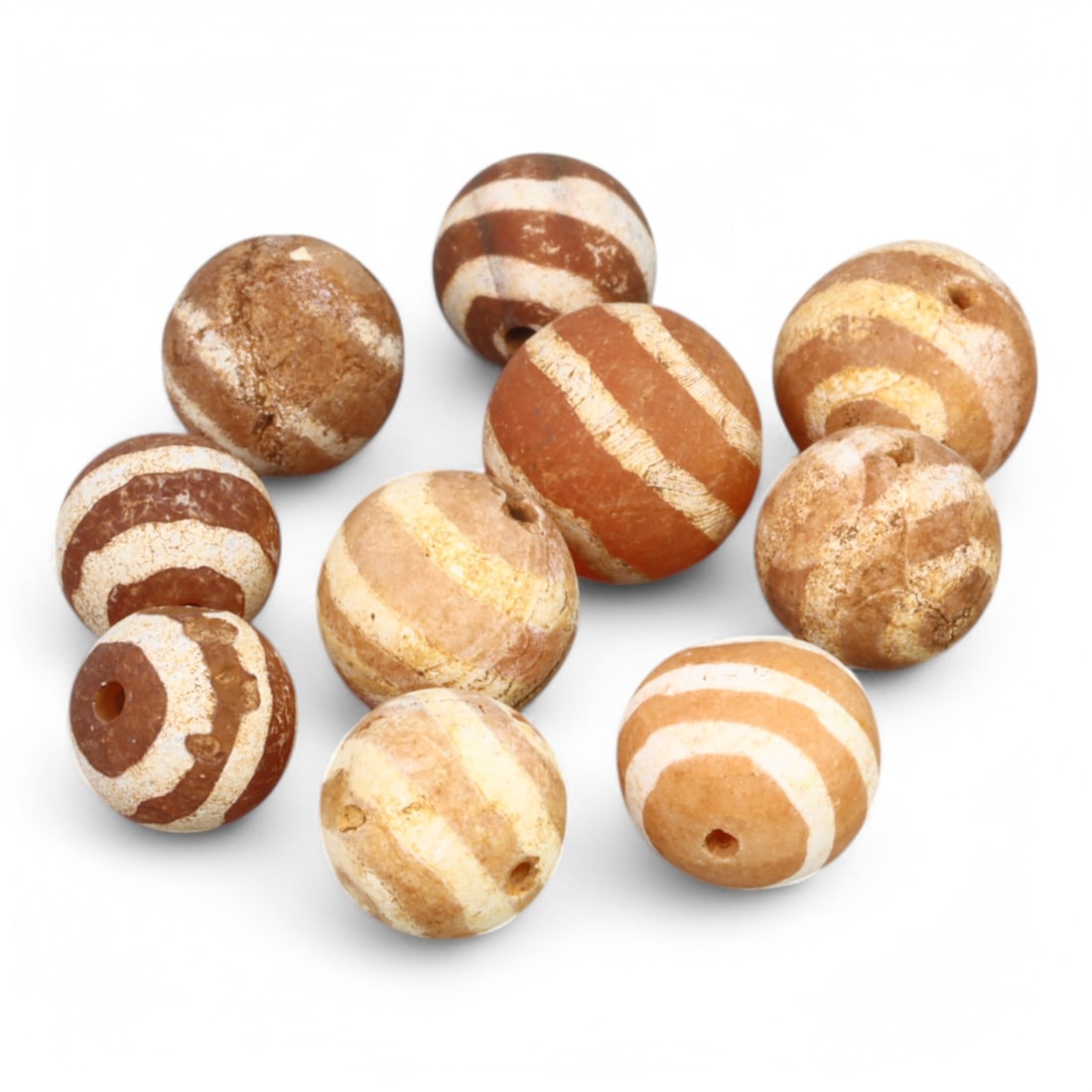 TIBETAN CULTURE: Antique Etched Carnelian Mala Beads (10g, 10-12mm): This set of antique Tibetan mala beads is crafted from etched carnelian, featuring intricate white zigzag and linear patterns that enhance their spiritual significance and aesthetic appeal. These bead