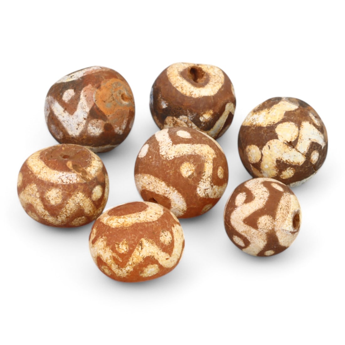 TIBETAN CULTURE: Antique Etched Carnelian Mala Beads (18g, 10-12mm): This set of antique Tibetan mala beads is crafted from etched carnelian, featuring intricate white zigzag and linear patterns that enhance their spiritual significance and aesthetic appeal. These bead