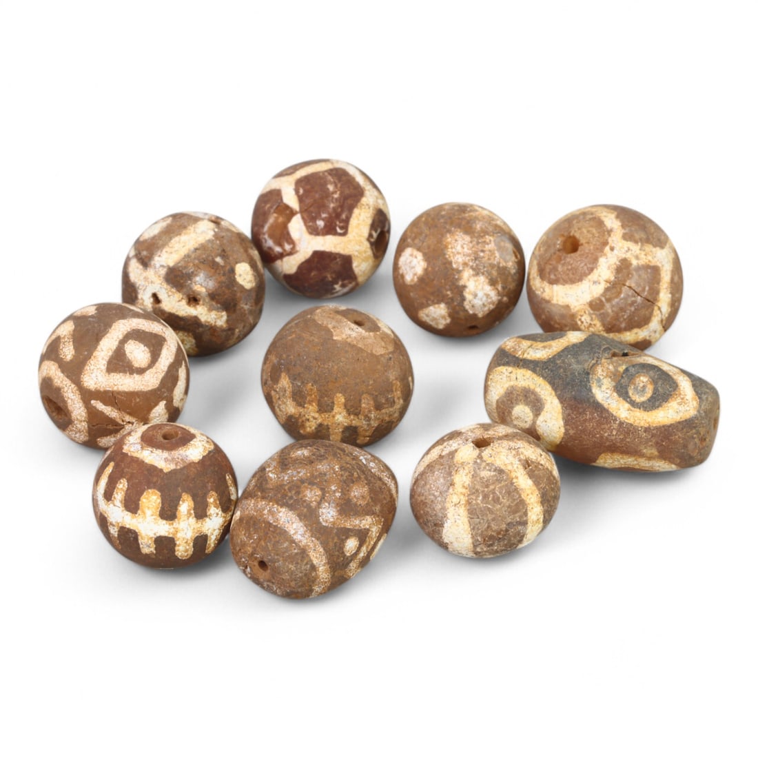 TIBETAN CULTURE: Antique Etched Carnelian Mala Beads (17g, 9-16mm): This set of antique Tibetan mala beads is crafted from etched carnelian, featuring intricate white zigzag and linear patterns that enhance their spiritual significance and aesthetic appeal. These bead