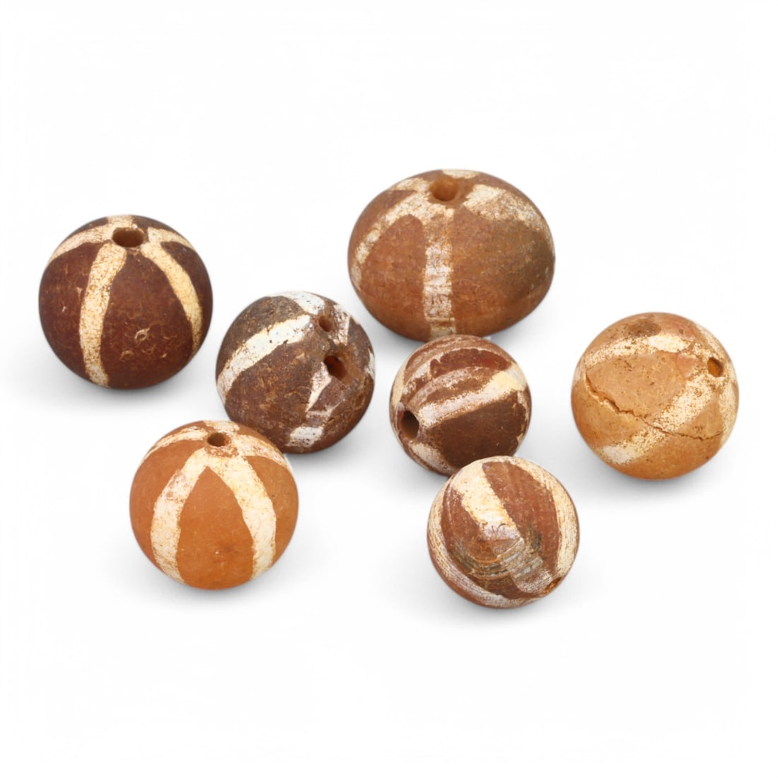 TIBETAN CULTURE: Antique Etched Carnelian Mala Beads (9g, 10-12mm): This set of antique Tibetan mala beads is crafted from etched carnelian, featuring intricate white zigzag and linear patterns that enhance their spiritual significance and aesthetic appeal. These bead