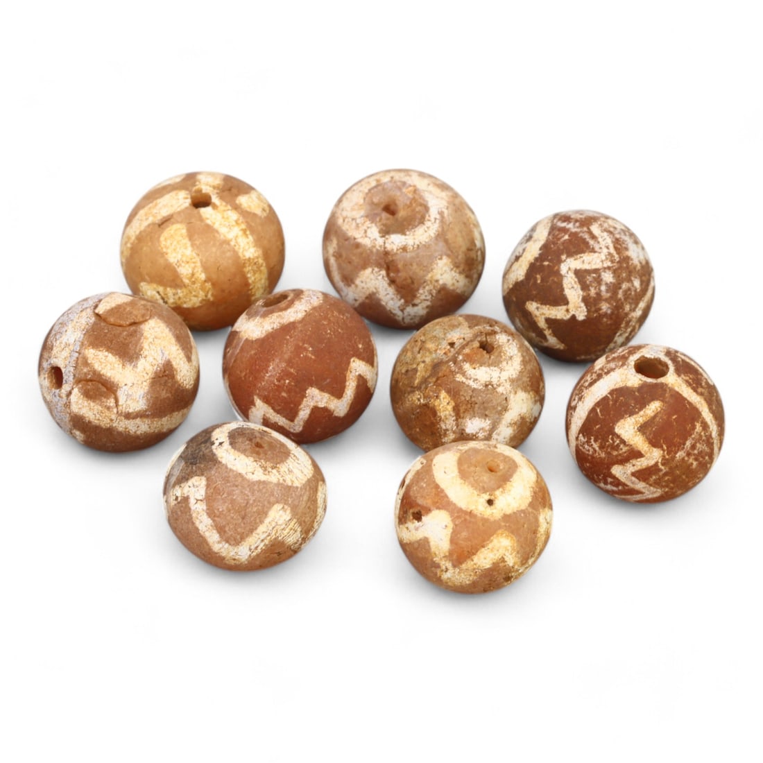 TIBETAN CULTURE: Antique Etched Carnelian Mala Beads (13g, 10-12mm): This set of antique Tibetan mala beads is crafted from etched carnelian, featuring intricate white zigzag and linear patterns that enhance their spiritual significance and aesthetic appeal. These bead