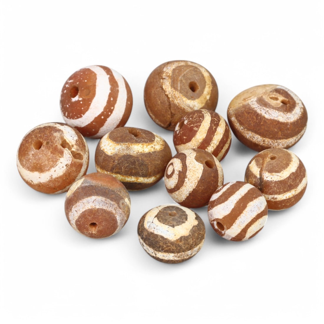 TIBETAN CULTURE: Antique Etched Carnelian Mala Beads (13g, 10-12mm): This set of antique Tibetan mala beads is crafted from etched carnelian, featuring intricate white zigzag and linear patterns that enhance their spiritual significance and aesthetic appeal. These bead