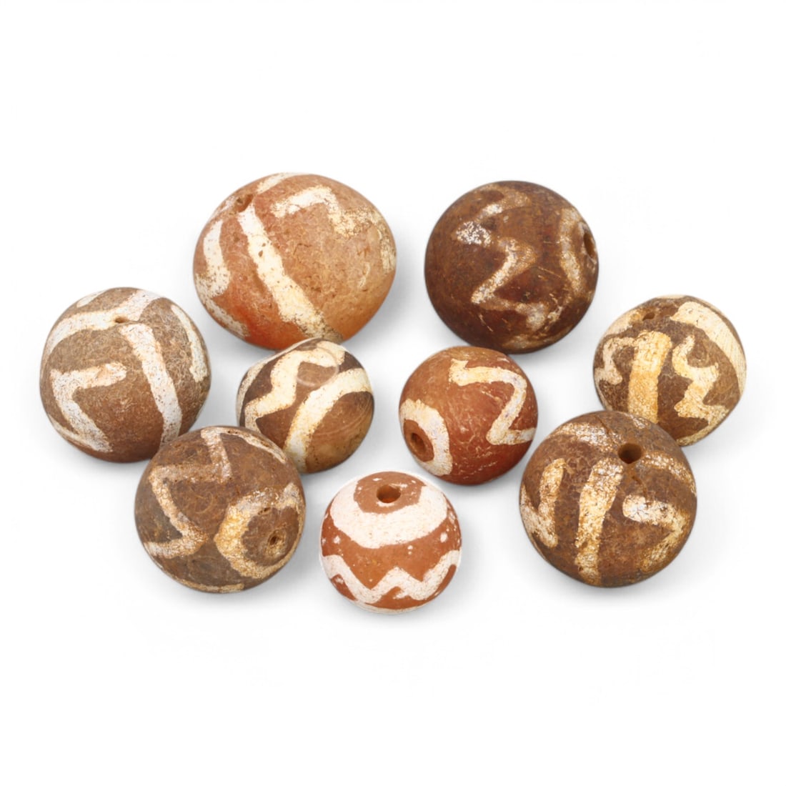 TIBETAN CULTURE: Antique Etched Carnelian Mala Beads (11g, 10-12mm): This set of antique Tibetan mala beads is crafted from etched carnelian, featuring intricate white zigzag and linear patterns that enhance their spiritual significance and aesthetic appeal. These bead