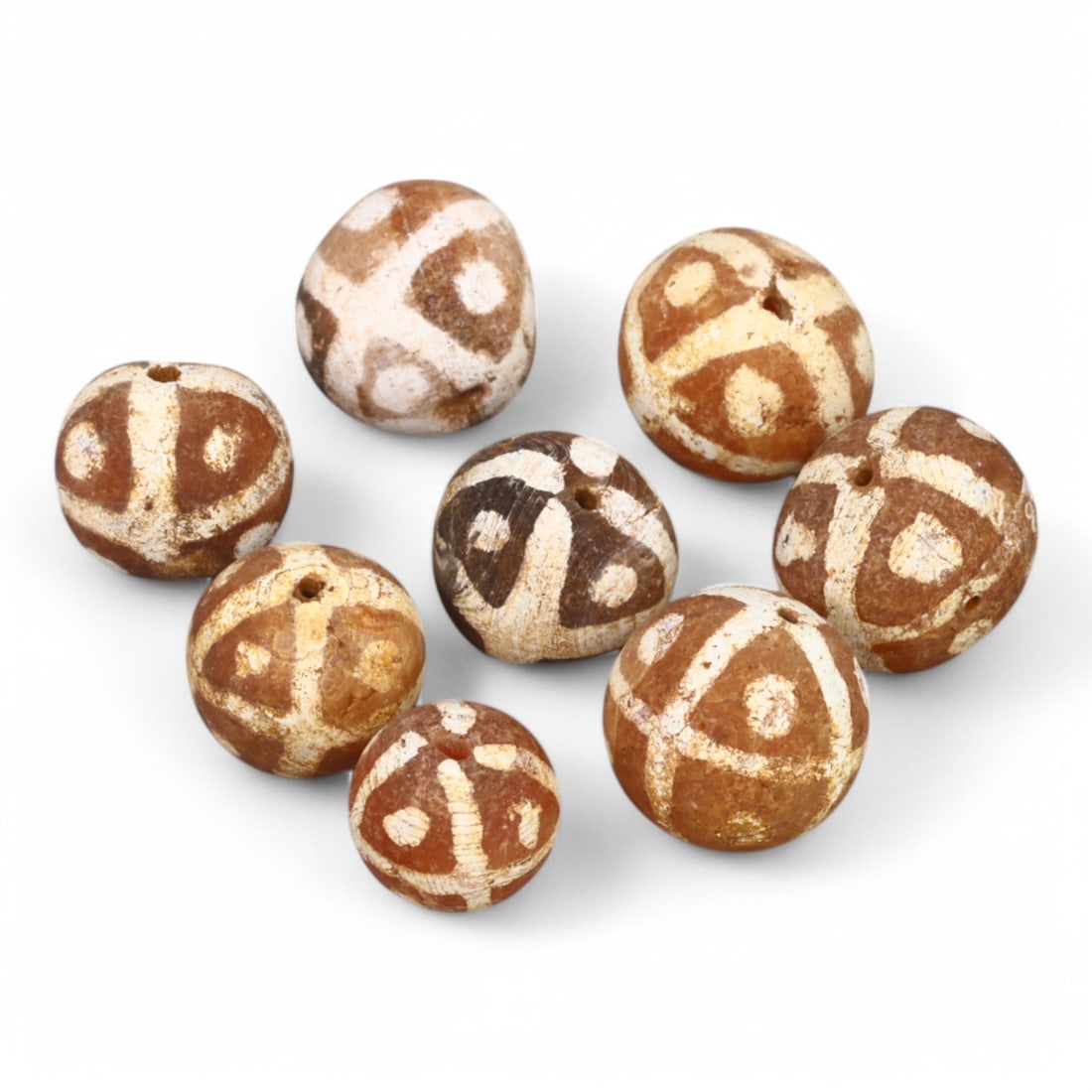 TIBETAN CULTURE: Antique Etched Carnelian Mala Beads (10g, 10-12mm): This set of antique Tibetan mala beads is crafted from etched carnelian, featuring intricate white zigzag and linear patterns that enhance their spiritual significance and aesthetic appeal. These bead