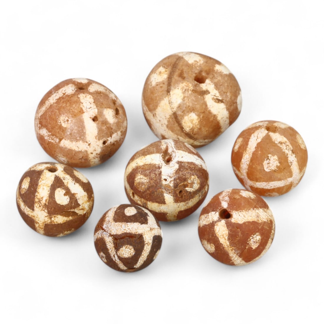 TIBETAN CULTURE: Antique Etched Carnelian Mala Beads (9g, 10-12mm): This set of antique Tibetan mala beads is crafted from etched carnelian, featuring intricate white zigzag and linear patterns that enhance their spiritual significance and aesthetic appeal. These bead