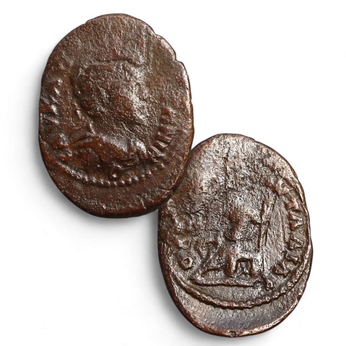 ROMAN EMPIRE: AE Bronze Coin (23x17mm, 3g): This Roman bronze coin features a distinct oblong shape, measuring 23x17mm and weighing 3g. The obverse presents a profile of an emperor, a traditional representation of imperial authority and divine 
