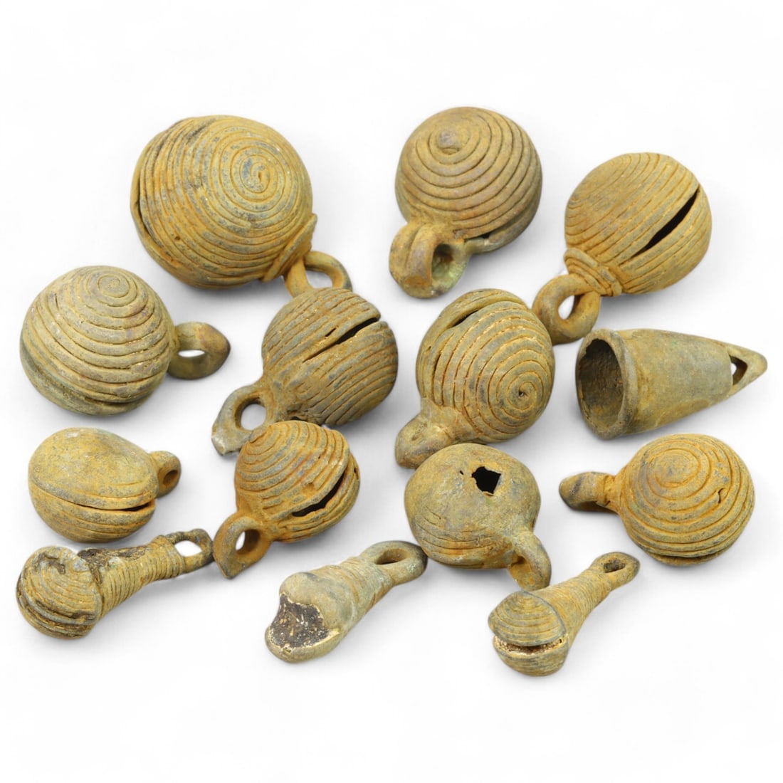 AFRICAN TRIBAL: Lot of West African Bronze Bells (150g, 1-2cm each): This collection of intricately crafted bronze bells originates from African tribal traditions, likely used as adornments, musical instruments, or ritual objects. Each bell features distinctive spiral