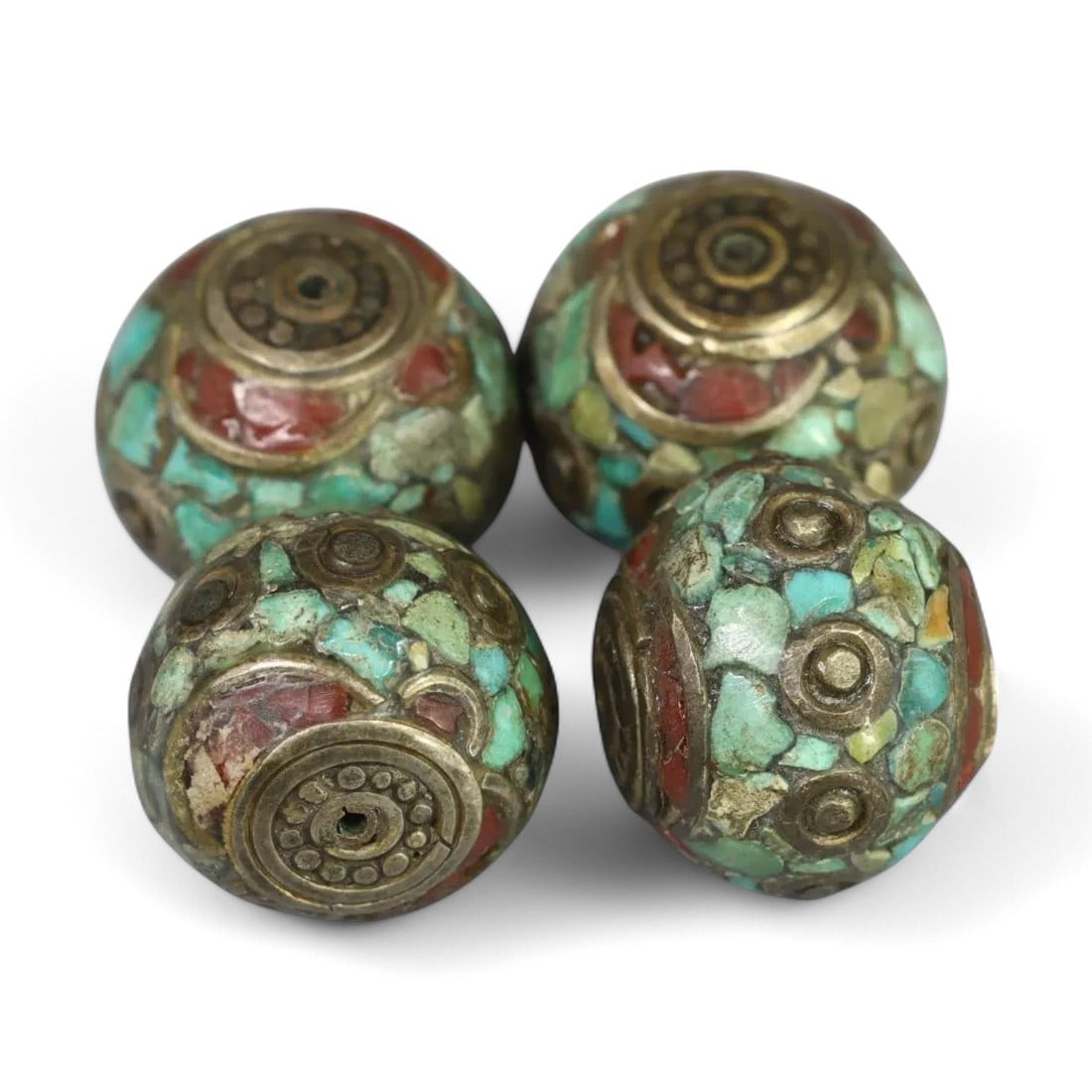 ANTIQUE TIBETAN: Turquoise and Coral Inlaid Beads, Circa 19th Century (19x16mm, 4 Pieces): These striking antique Tibetan beads feature intricate inlays of turquoise and coral, set against ornate brass bases. Each bead measures 19x16mm and showcases the vibrant artistry and symbolic designs