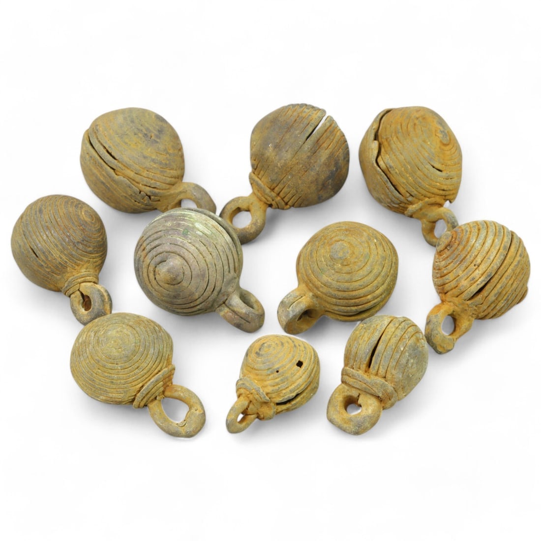 AFRICAN TRIBAL: Lot of West African Bronze Bells (126g, 1-2cm each): This collection of intricately crafted bronze bells originates from African tribal traditions, likely used as adornments, musical instruments, or ritual objects. Each bell features distinctive spiral