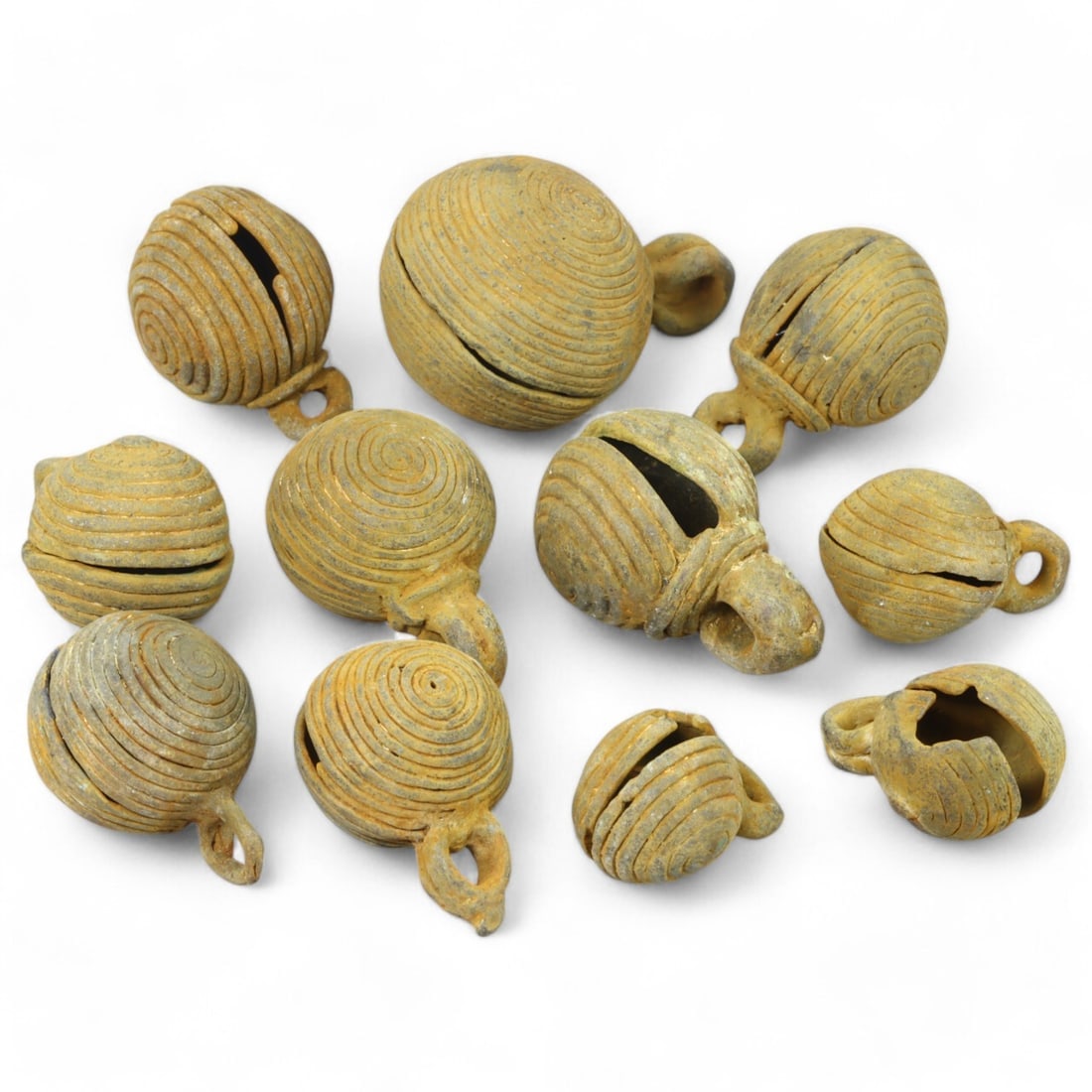 AFRICAN TRIBAL: Lot of West African Bronze Bells (134g, 1-2cm each): This collection of intricately crafted bronze bells originates from African tribal traditions, likely used as adornments, musical instruments, or ritual objects. Each bell features distinctive spiral