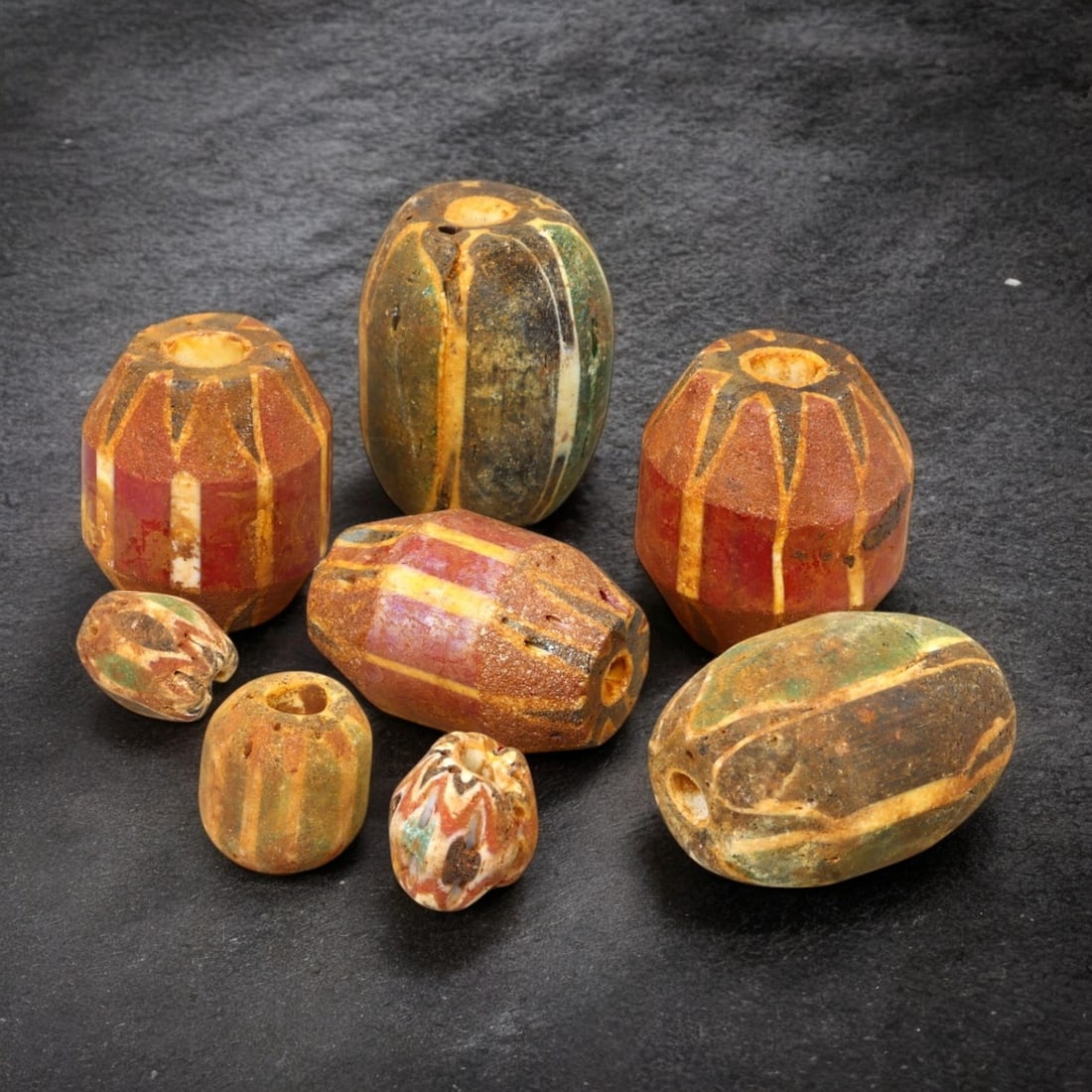 AFRICAN: Antique Chevron and Trade Beads, (108g, 12-29mm): This remarkable lot features African antique chevron and trade beads, weighing a total of 108 grams with individual beads ranging from 12 to 29mm in size. These beads display a striking variety of sha