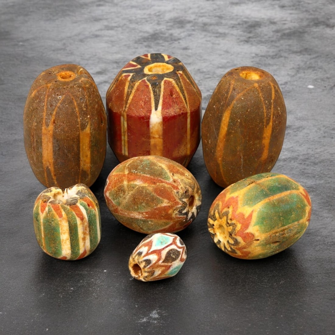 AFRICAN: Antique Chevron and Trade Beads, (87g, 13-28mm): This remarkable lot features African antique chevron and trade beads, weighing a total of 87 grams with individual beads ranging from 13 to 28mm in size. These beads display a striking variety of shap