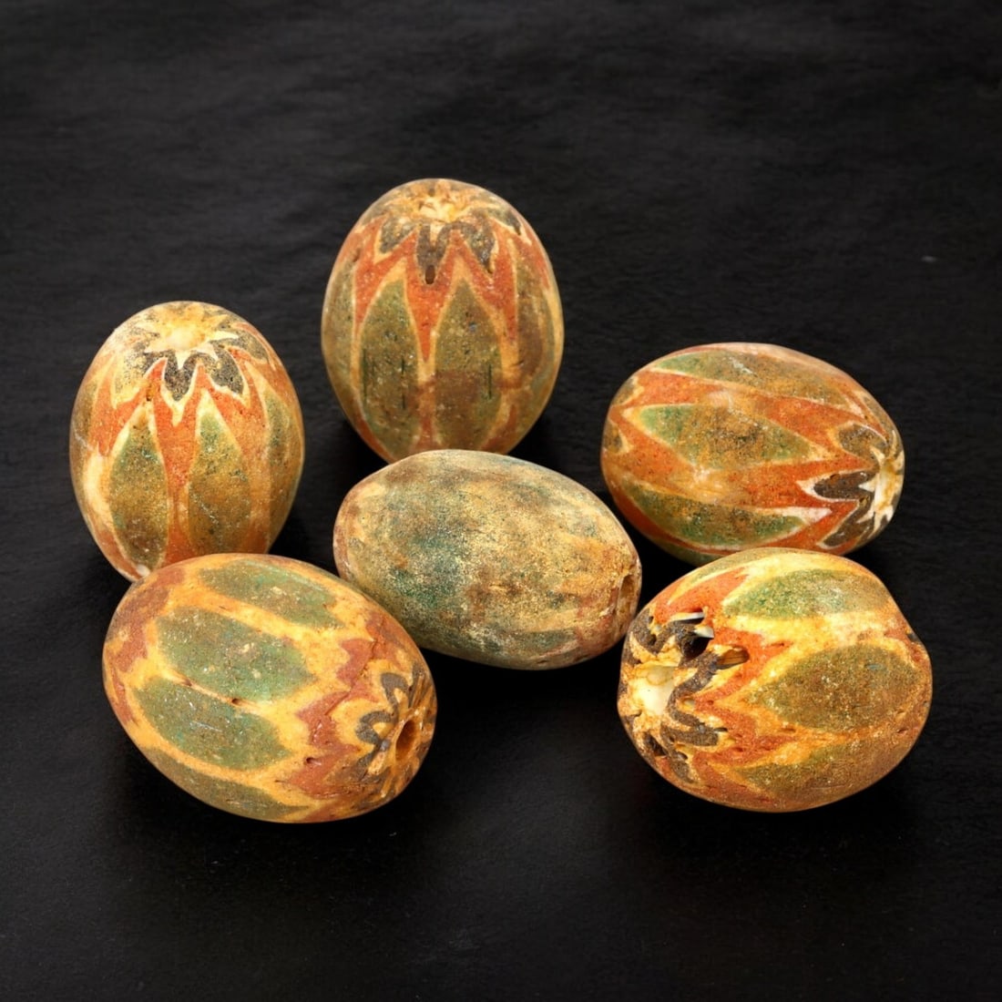 AFRICAN: Antique Chevron and Trade Beads, (64g, 21-23mm): This remarkable lot features African antique chevron and trade beads, weighing a total of 64 grams with individual beads ranging from 21 to 23mm in size. These beads display a striking variety of shap