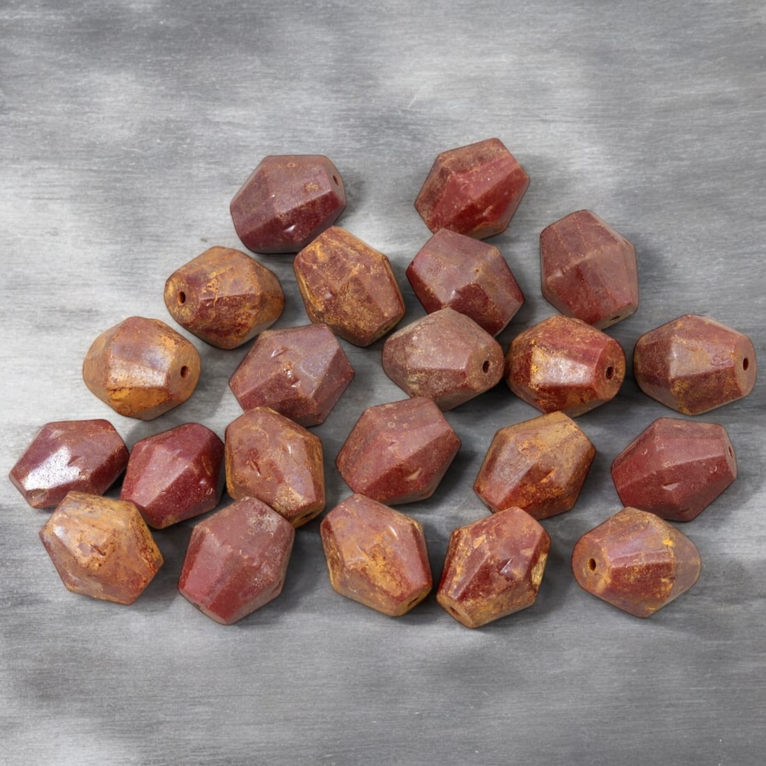 AFRICAN: Antique Faceted Carnelian Beads, (111g, 1.5cm): This striking lot features African antique faceted carnelian beads, weighing a total of 111 grams with individual beads measuring approximately 1.5cm in size. These beads are expertly hand-cut into ge