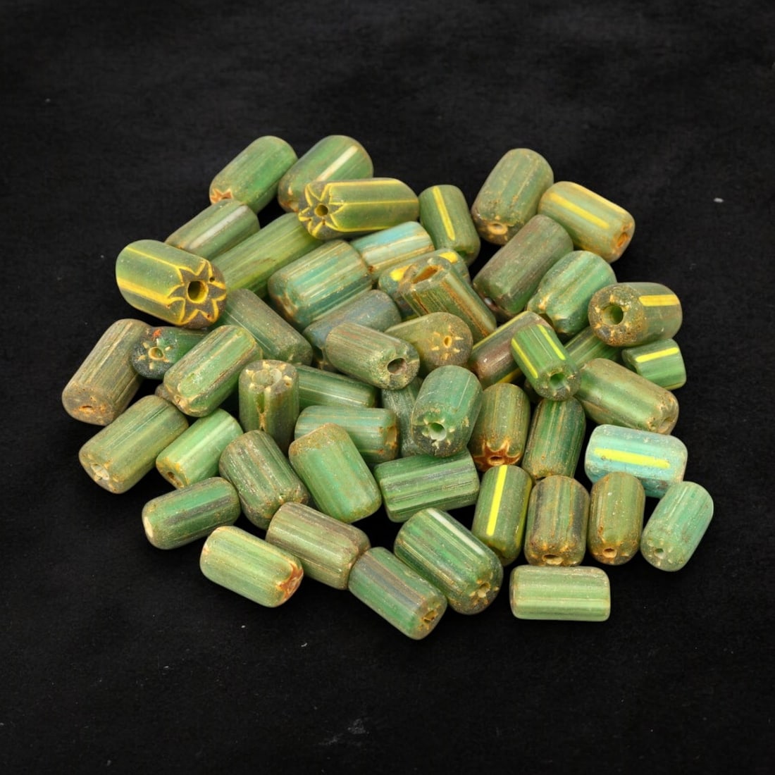 VENETIAN: Antique Millefiori Trade Beads, (42g, 1-2cm): This exceptional lot features Venetian antique millefiori trade beads, weighing a total of 42 grams with individual beads measuring between 1 and 2cm in size. These vibrant, cylindrical beads showcase
