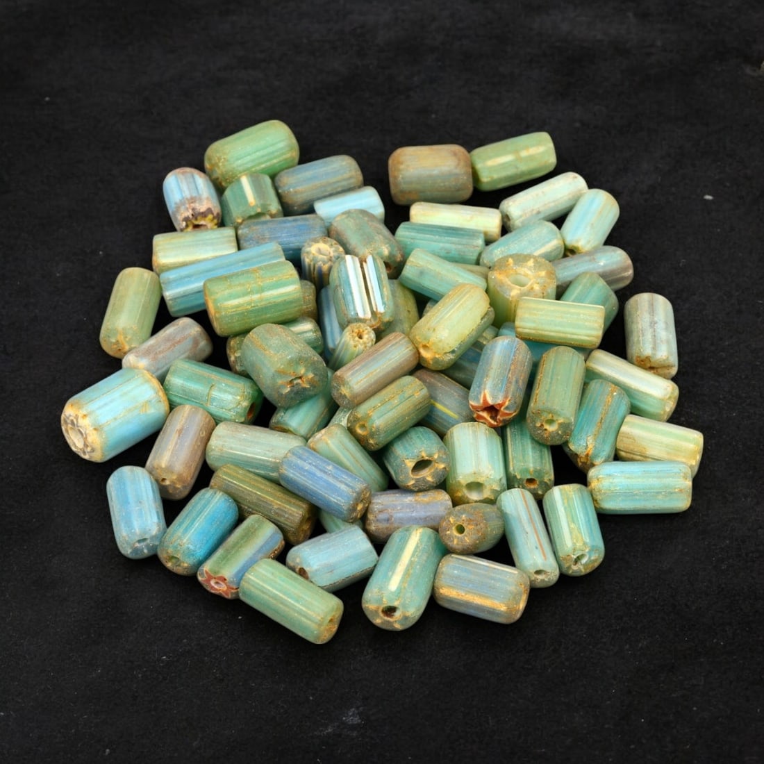 VENETIAN: Antique Millefiori Trade Beads, (48g, 1-2cm): This exceptional lot features Venetian antique millefiori trade beads, weighing a total of 48 grams with individual beads measuring between 1 and 2cm in size. These vibrant, cylindrical beads showcase