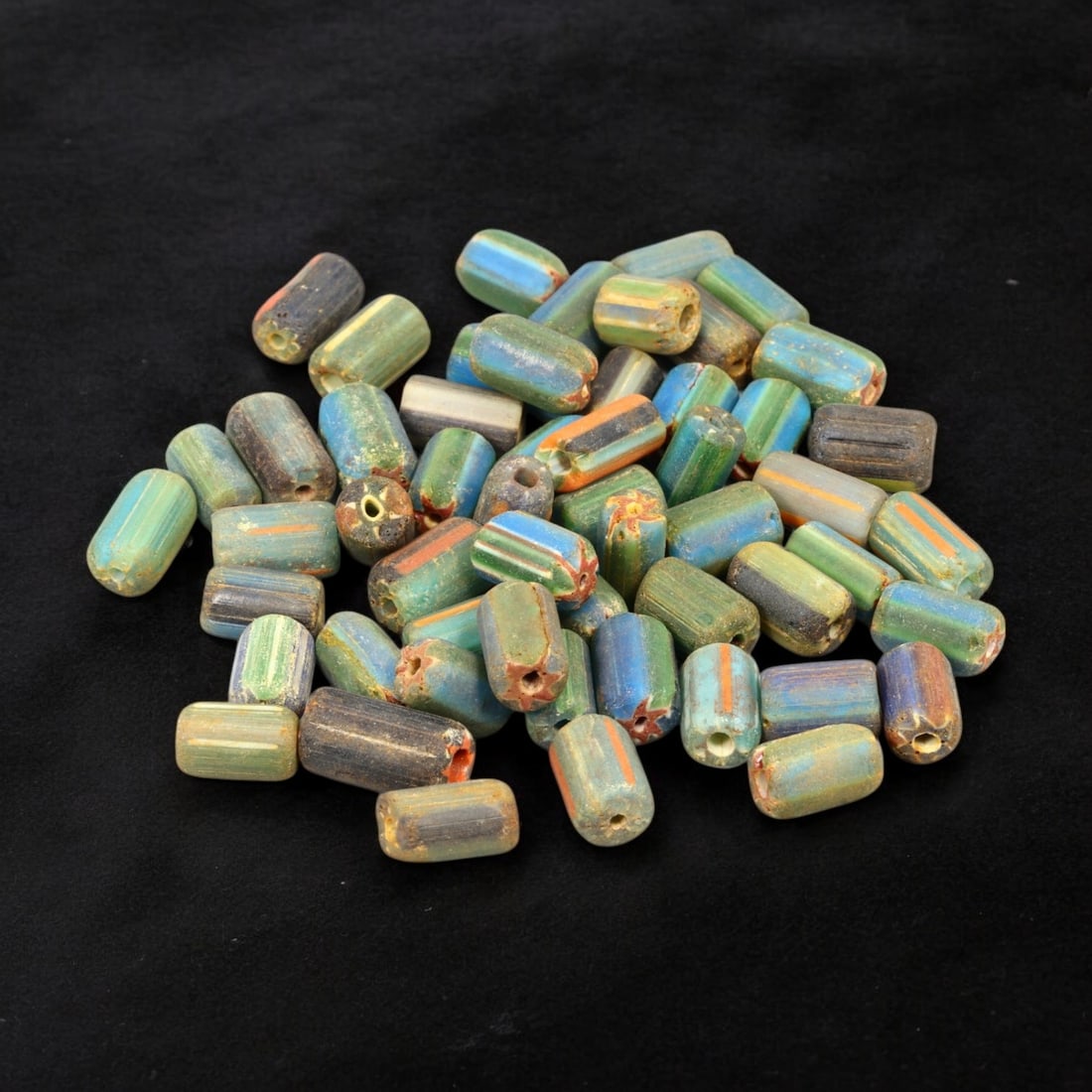 VENETIAN: Antique Millefiori Trade Beads, (46g, 1-2cm): This exceptional lot features Venetian antique millefiori trade beads, weighing a total of 46 grams with individual beads measuring between 1 and 2cm in size. These vibrant, cylindrical beads showcase