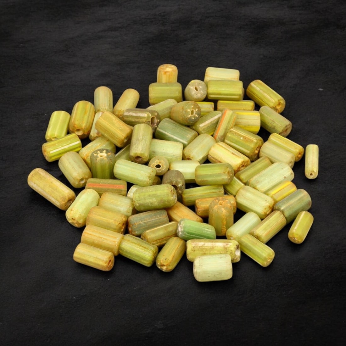 VENETIAN: Antique Millefiori Trade Beads, (54g, 1-2cm): This exceptional lot features Venetian antique millefiori trade beads, weighing a total of 54 grams with individual beads measuring between 1 and 2cm in size. These vibrant, cylindrical beads showcase