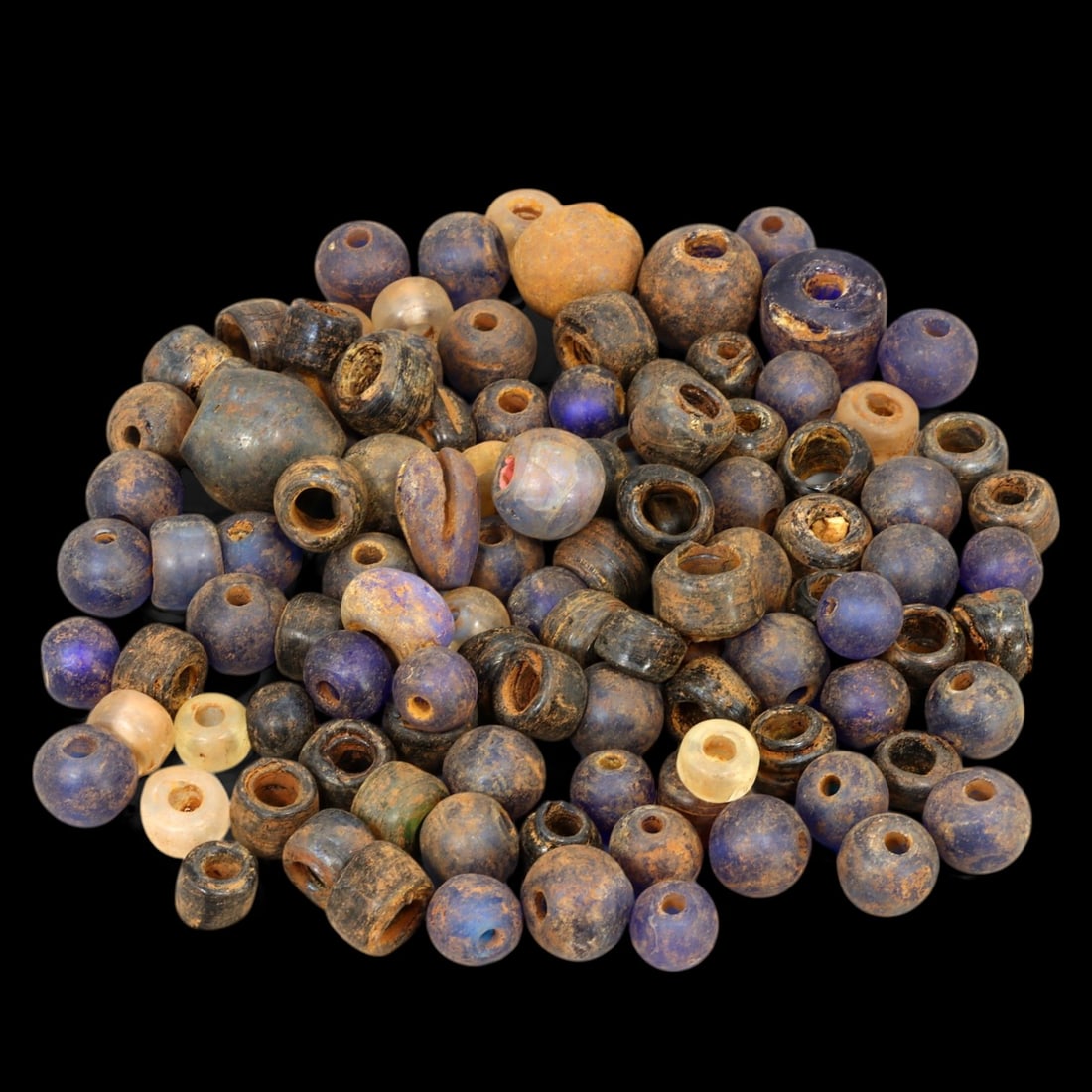 AFRICAN: Antique Blue and Brown Glass Trade Beads, (118g, 10-15mm): This captivating lot features African antique blue and brown glass trade beads, with a total weight of 118 grams and individual bead sizes ranging from 10 to 15 mm. The collection showcases an array o