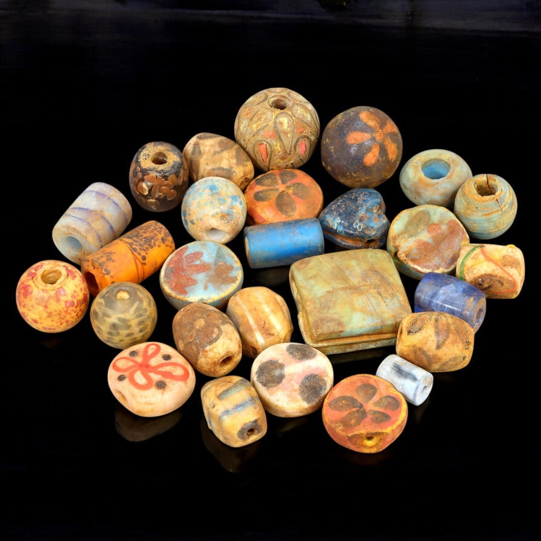 AFRICAN: Antique Mixed Polychrome Glass Trade Beads with Floral Motifs, (130g, 1-2.5cm): This vibrant lot features African antique mixed polychrome glass trade beads, with a total weight of 130 grams and individual bead sizes ranging from 1 to 2.5 cm. The collection showcases a diverse ar