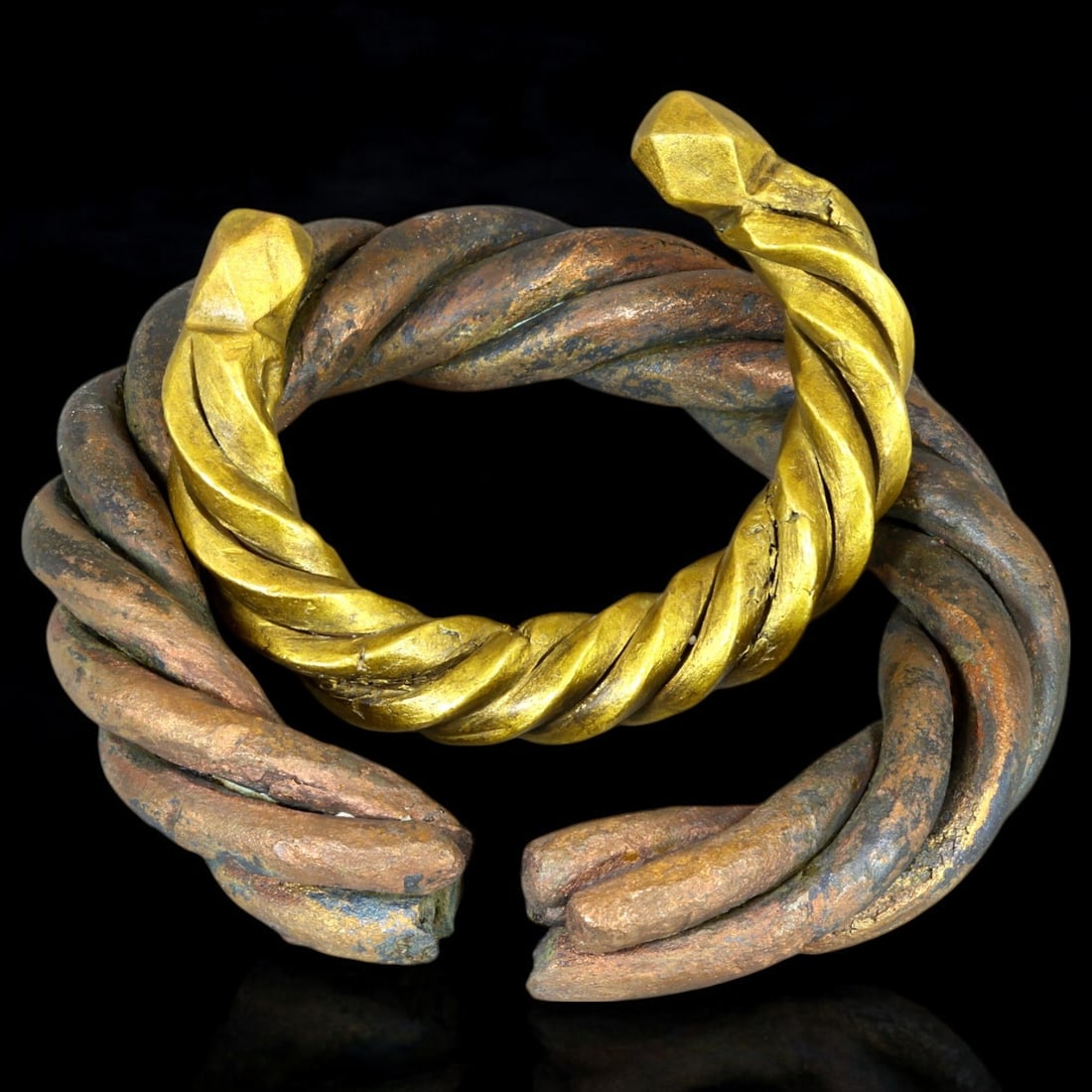 ANTIQUE BRONZE BRACELETS: Lot of Bronze Adornments (626g, 8-11cm): This lot features a collection of antique bronze bracelets, showcasing diverse styles and craftsmanship reflective of different cultural influences. The bracelets vary slightly in size and design, wit