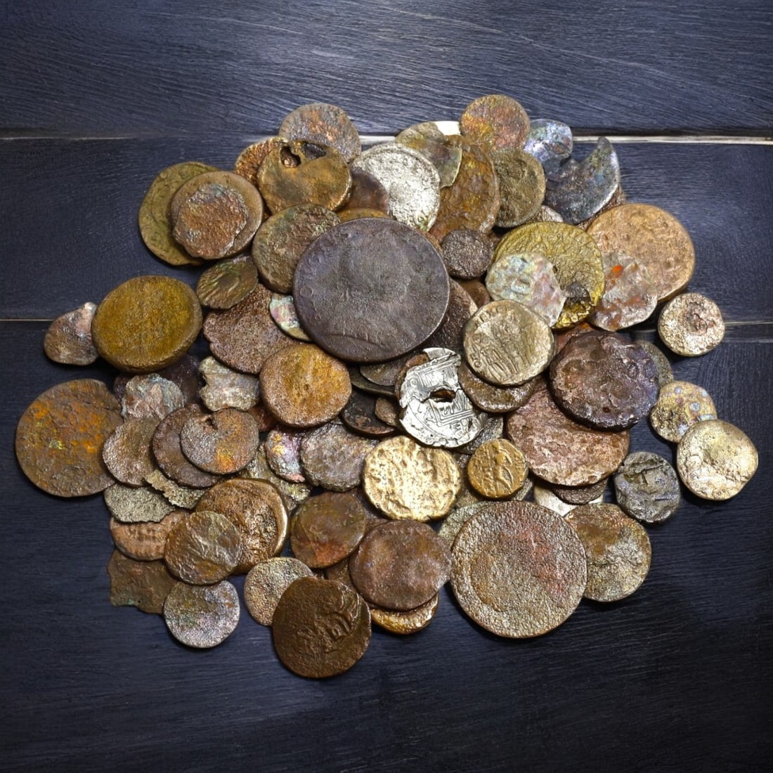 ANCIENT COINS COLLECTION: Mixed AE Coins (13-28mm, 190g total): This diverse collection of ancient bronze (AE) coins showcases a fascinating array of designs, featuring portraits, symbolic motifs, and geometric patterns that reflect the rich tapestry of ancient ci