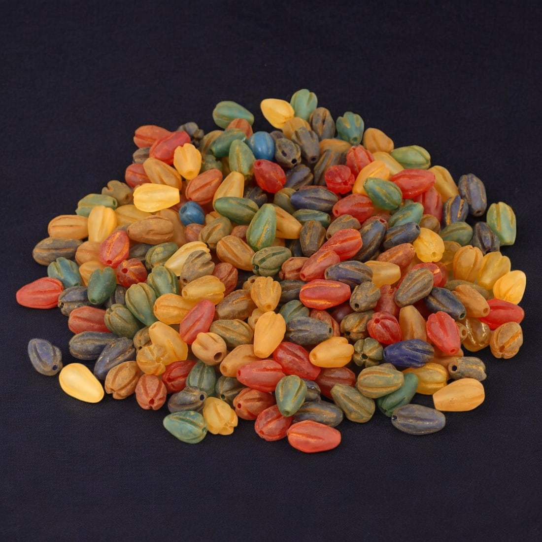 AFRICAN: Antique Carved Glass Beads, (302g, 17mm): This vibrant lot features African antique carved glass beads, with a total weight of 302 grams and individual beads measuring approximately 17mm in size. These intricately carved, multicolored beads r