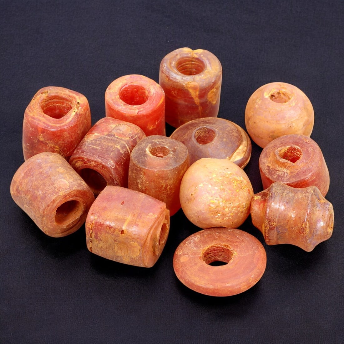 AFRICAN: Antique Carnelian Barrel Beads, (52g, 1-2cm): This vibrant lot features African antique carnelian barrel beads, with a total weight of 52 grams and individual beads ranging from 1 to 2 cm in size. These beads showcase warm reddish-orange hues, ch