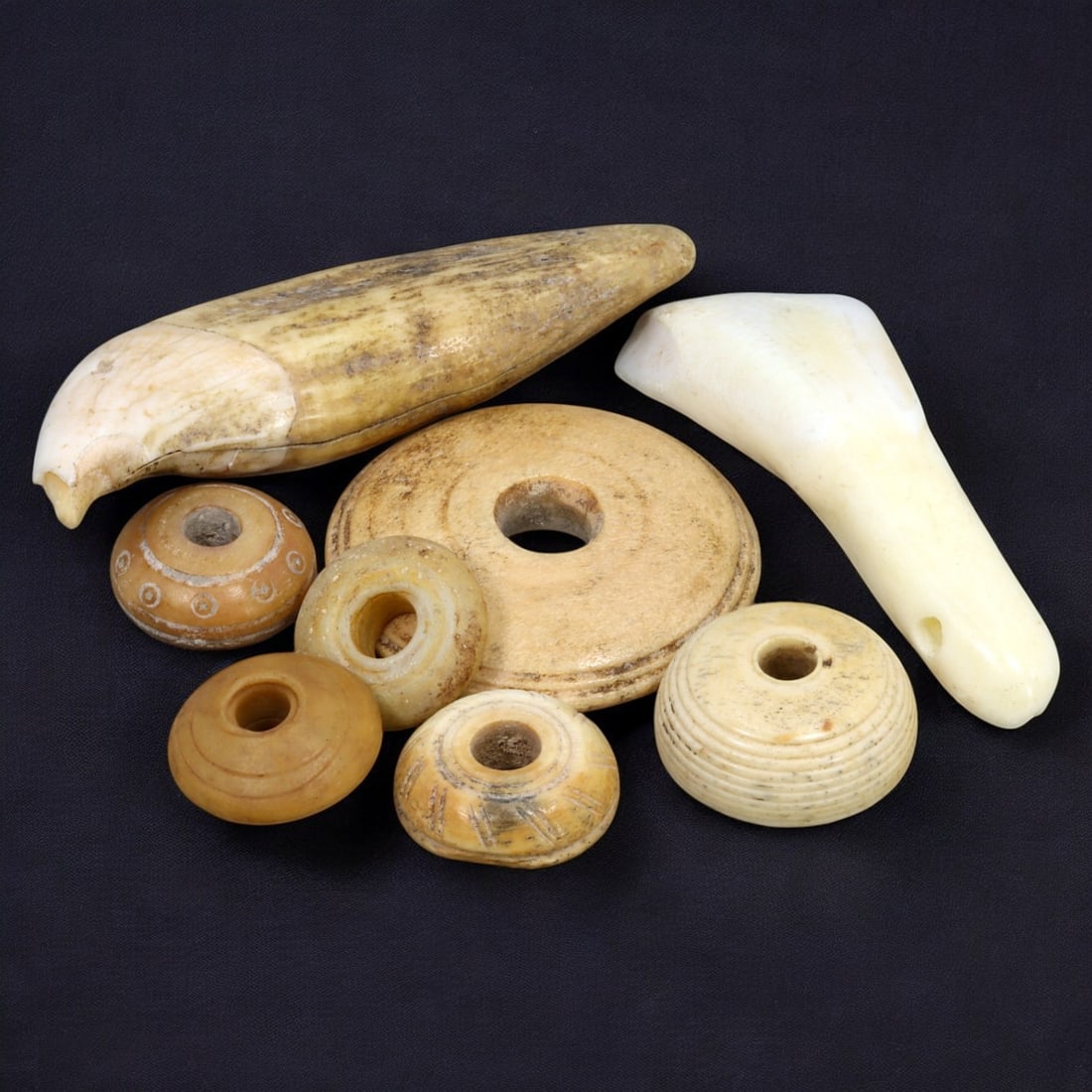 AFRICAN: Antique Bone and Ivory Ornaments, (42g, 2-6cm): This distinctive lot features African antique bone and ivory ornaments, with a total weight of 42 grams and individual pieces ranging from 2 to 6 cm in size. The collection includes a variety of shape