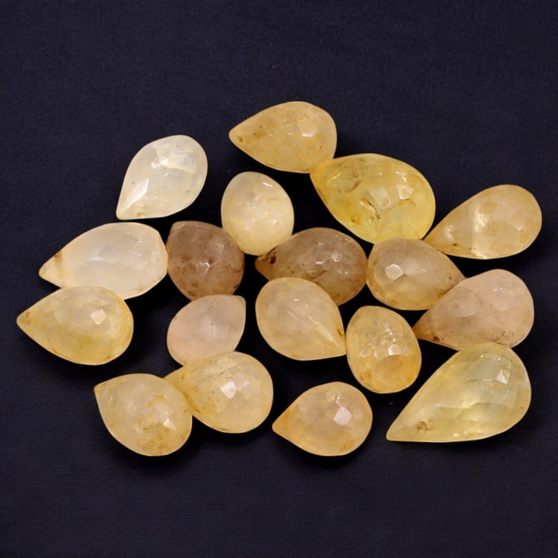 AFRICAN: Antique Faceted Citrine Beads, (14g, 10mm): This elegant lot features African antique faceted citrine beads, with a total weight of 14 grams and individual beads measuring approximately 10mm in size. The teardrop-shaped beads showcase warm, gol