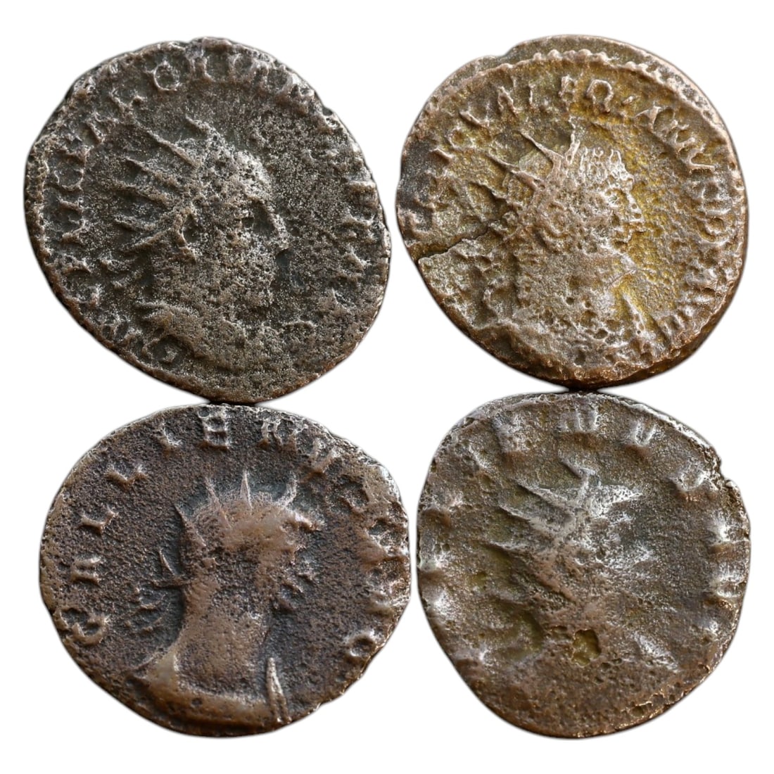 ROMAN EMPIRE - LOT OF 4 ANTONINIANI (17-18mm, 8.8g TOTAL): This lot consists of four Roman antoninianus coins, each displaying a radiate bust of an emperor on the obverse, a distinguishing feature of this denomination. The reverses likely feature deities, mil