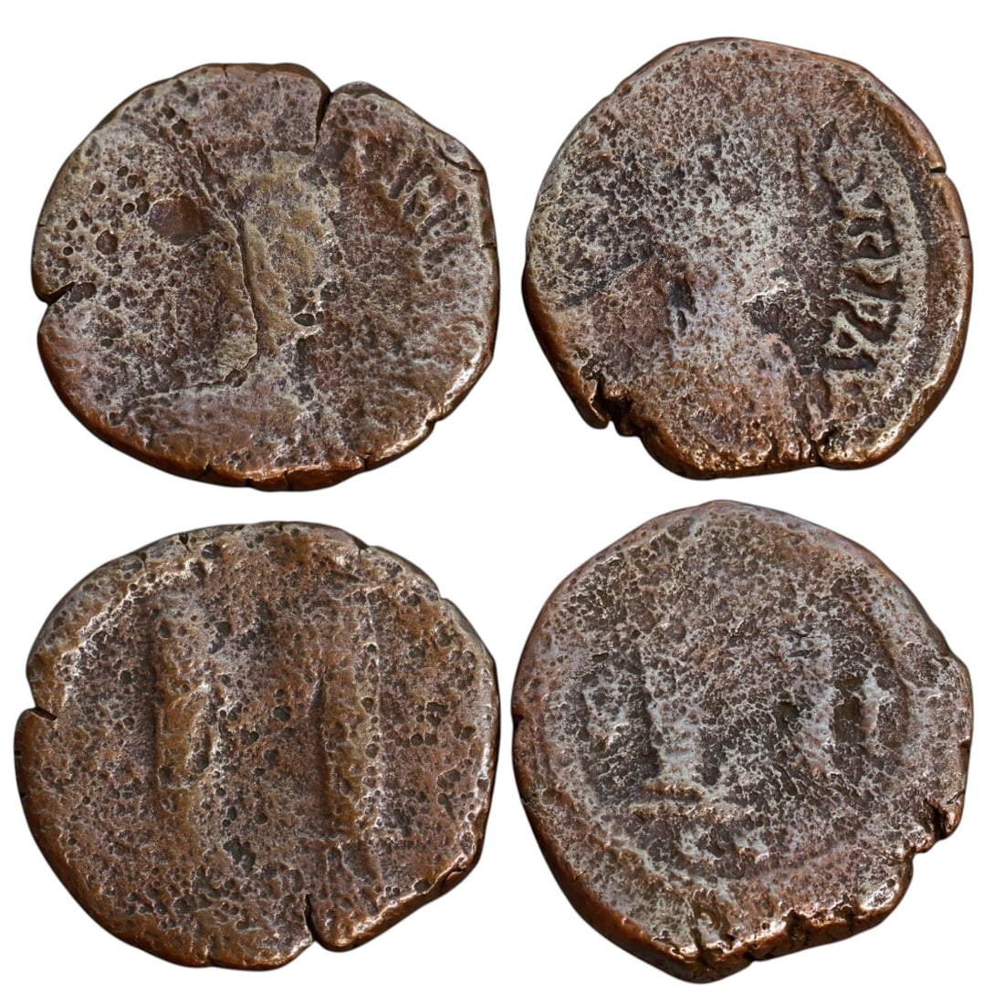BYZANTINE EMPIRE: 40 Nummi (Follis) of Justin I, Constantinople Mint (29-30mm, 28g, 2 Pieces): This lot contains two large Byzantine bronze folles (40 nummi) issued during the reign of Emperor Justin I (518-527 AD) and minted in Constantinople. The obverse likely features a stylized bust of Jus