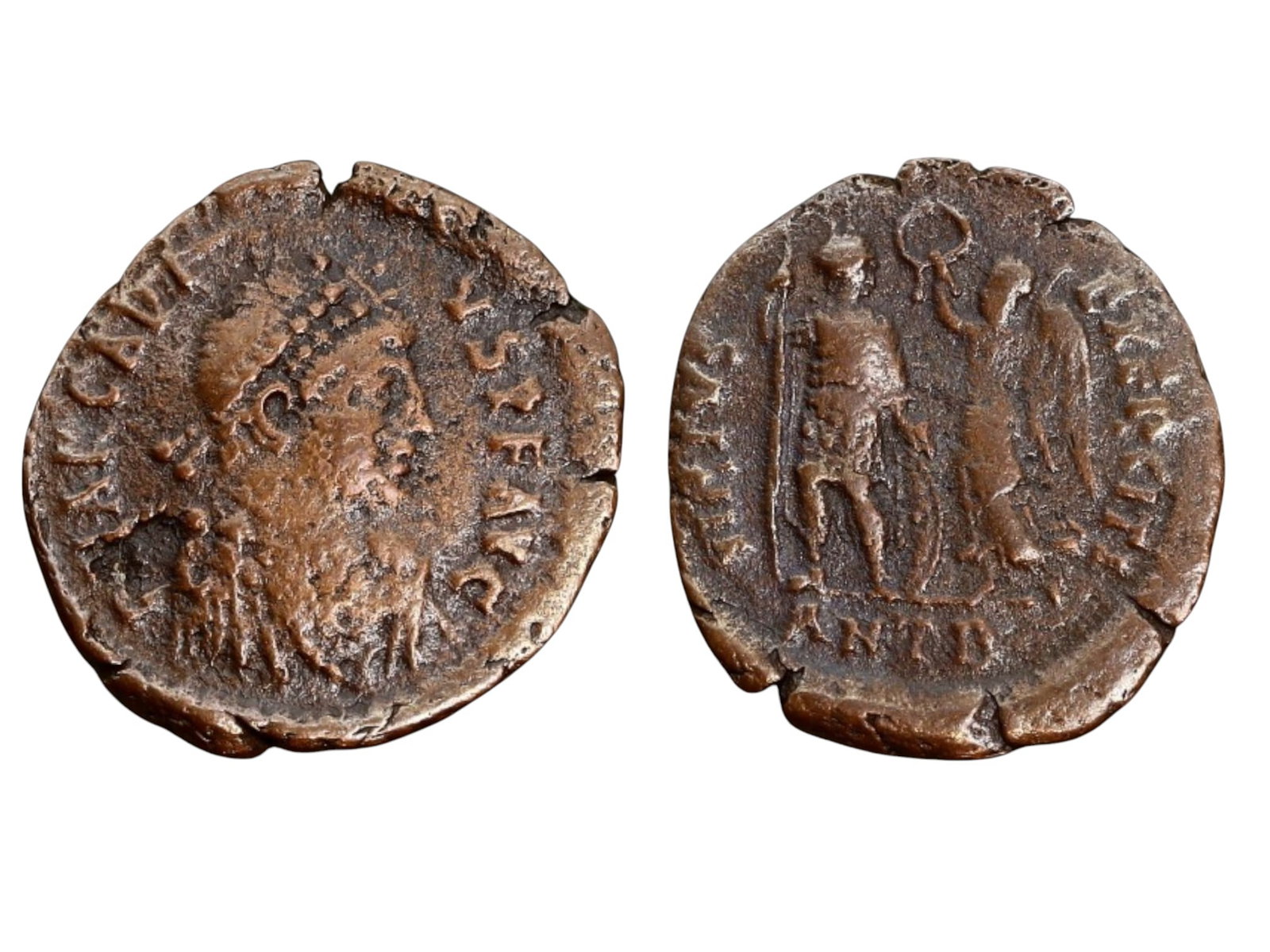 BYZANTINE EMPIRE - ARCADIUS, AE FOLLIS, ANTIOCH (AD 383-408, 17mm, 2.3g): This bronze follis was issued under Emperor Arcadius (AD 383-408) at the Antioch mint. The obverse features a diademed, draped, and cuirassed bust of Arcadius facing right, while the reverse depicts t