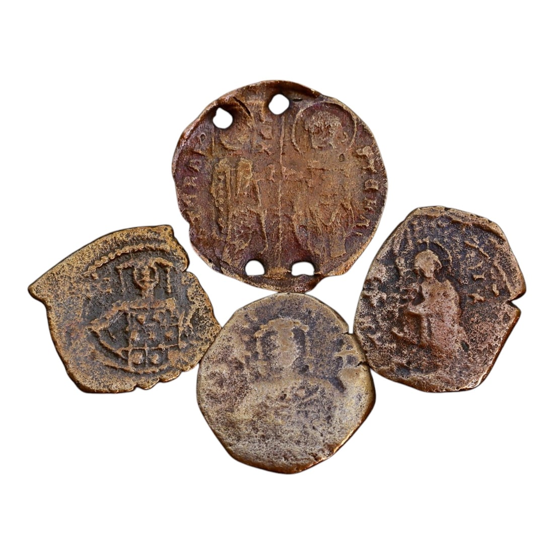 LOT OF 4 ANCIENT BYZANTINE BRONZE COINS, 13-18mm, 5.6g: This collection of Byzantine bronze coins reflects the distinctive coinage of the Eastern Roman (Byzantine) Empire. The obverses typically depict stylized imperial portraits, often with a frontal-faci