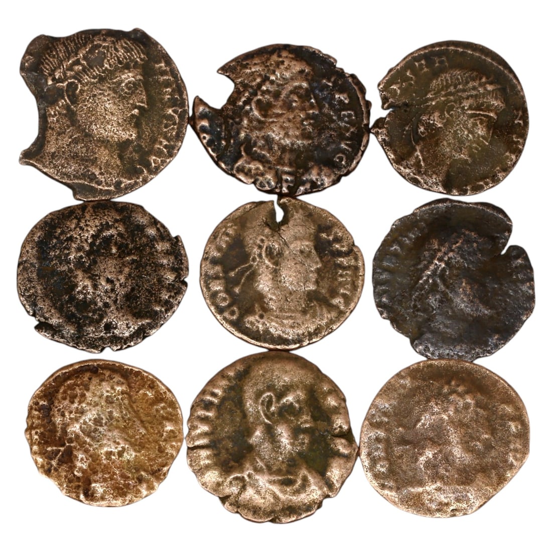 LOT OF 9 ANCIENT ROMAN IMPERIAL BRONZE COINS, 15-16mm, 11g: This set of Roman Imperial bronze coins showcases the diversity of coinage issued under various emperors. The obverses typically feature imperial portraits, emphasizing the authority and divine status