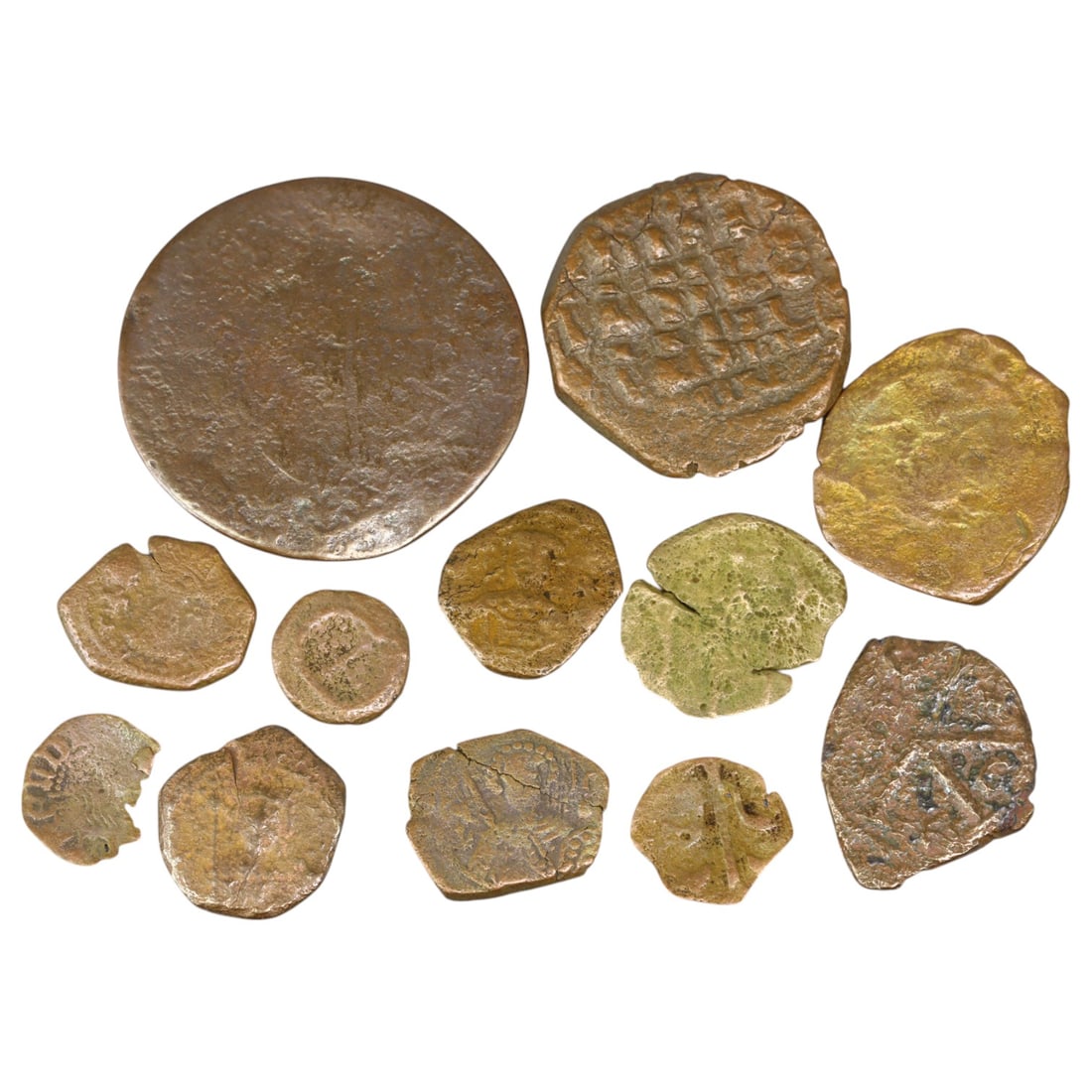 BYZANTINE EMPIRE: Lot of 12 Bronze (AE) Coins, Various Rulers (38g, 10-32mm): A diverse assemblage of Byzantine bronze (AE) coins, spanning various rulers and periods, offering a compelling glimpse into the numismatic landscape of the Byzantine Empire. These coins exhibit disti
