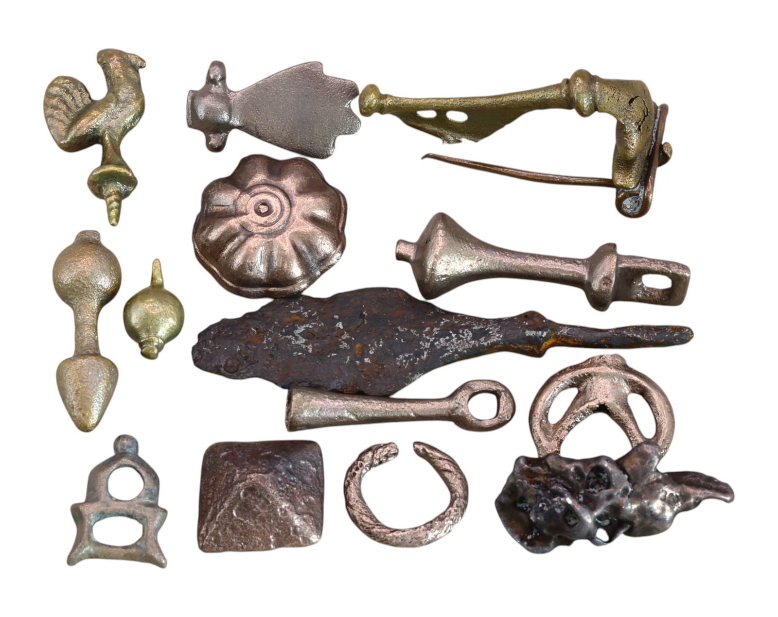 ANCIENT ROME: Collection of 12 Bronze & Iron Artifacts - Fibula, Amulets & Tools (75g, 1.4-7cm): A remarkable 12-piece assortment of ancient Roman bronze and iron artifacts, featuring an array of functional and decorative objects from the Roman world. This collection includes a well-preserved fib
