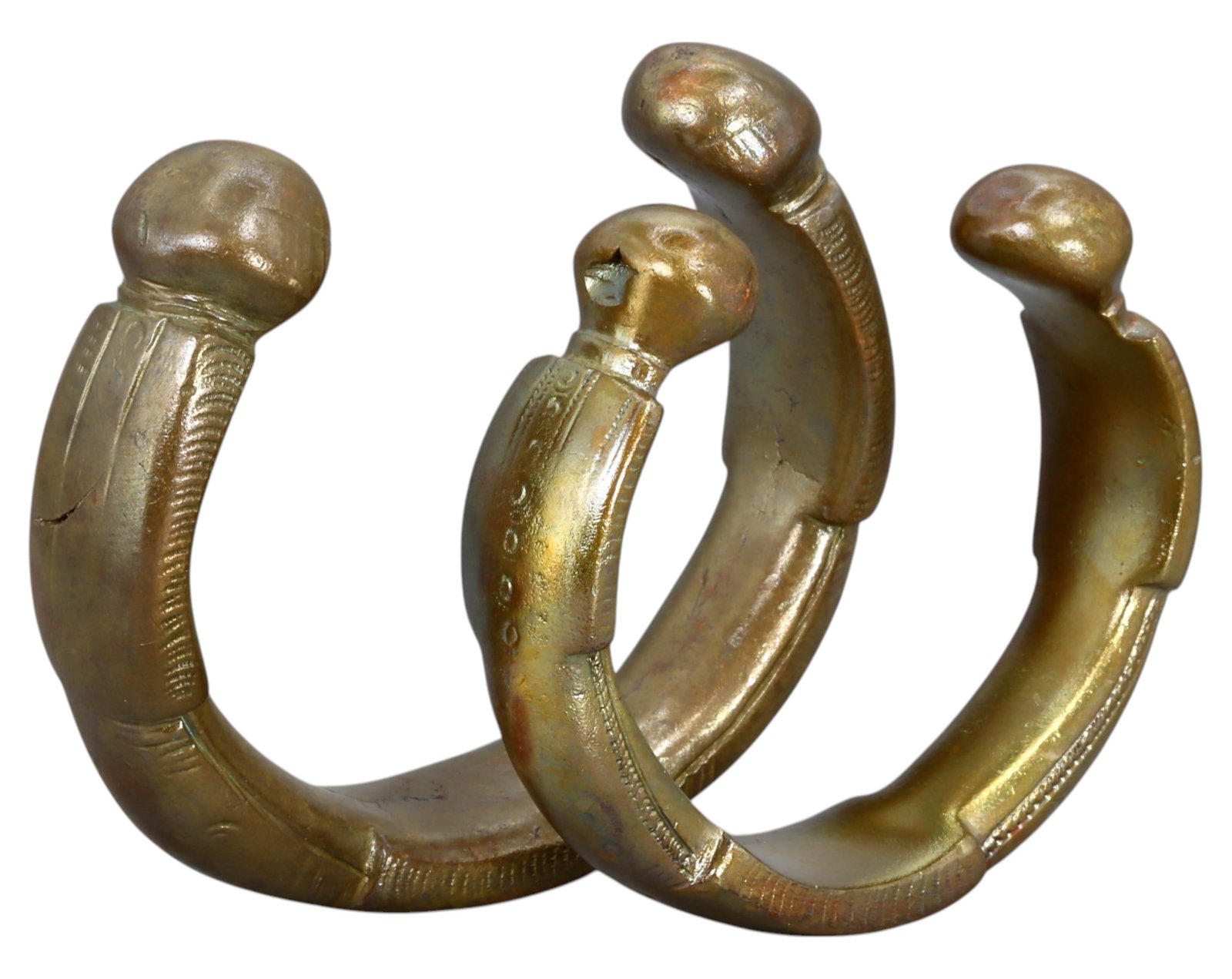 WEST AFRICA: Pair of Manilla Trade Currency - Bronze, 18th-19th Century: A solid and well-preserved pair of West African bronze manillas, measuring approximately 6.5-7.5 cm in diameter with a combined weight of 296g. These pieces feature rounded terminals with subtle linea