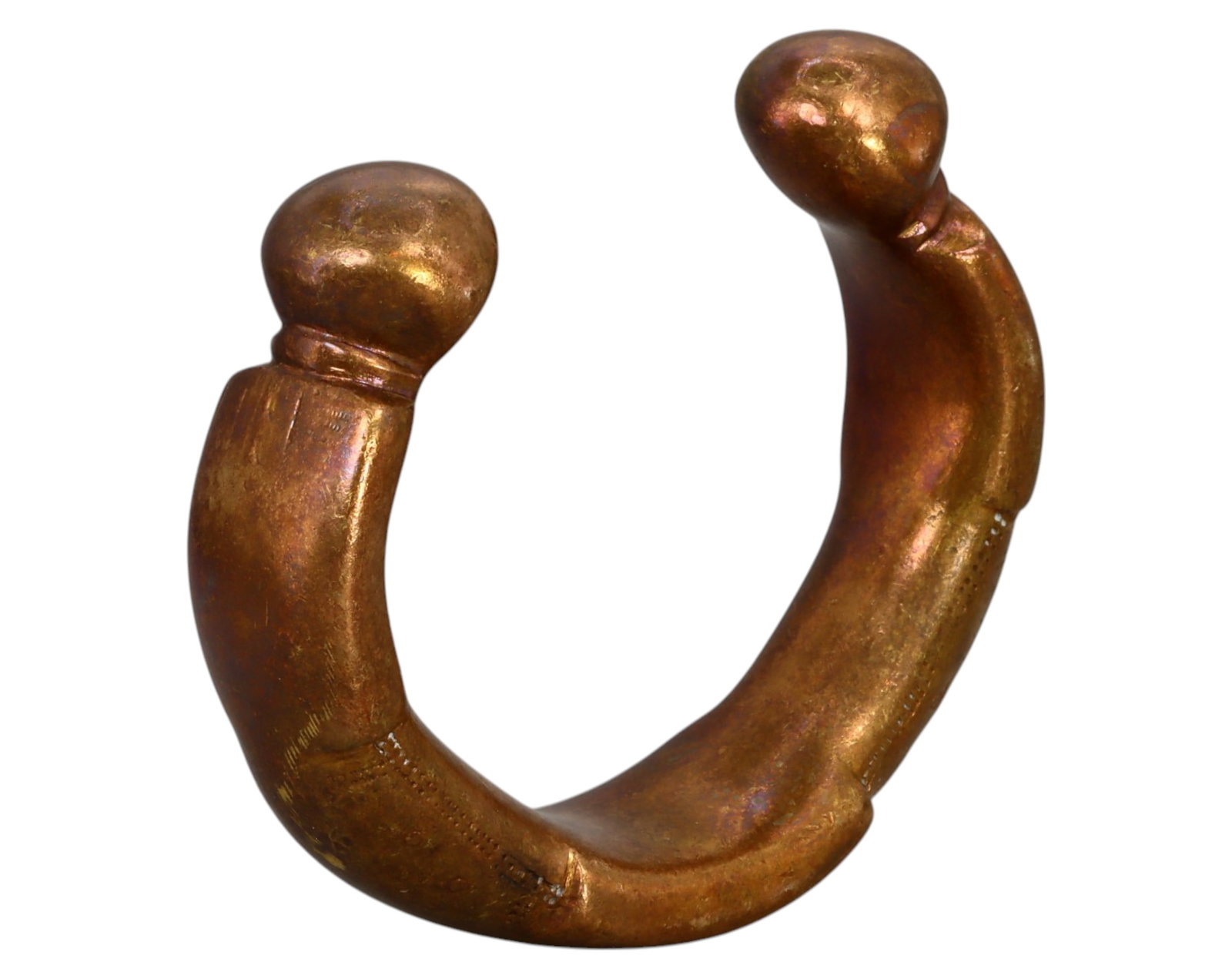 NIGERIA: King Manilla - Heavy Bronze Prestige Currency, 19th-20th Century: A large and weighty King Manilla, cast in bronze, measuring 9 x 2.5 cm and weighing 379g. This robust piece features a thick, rounded crescent shape with prominent, swollen terminals, characteristic o
