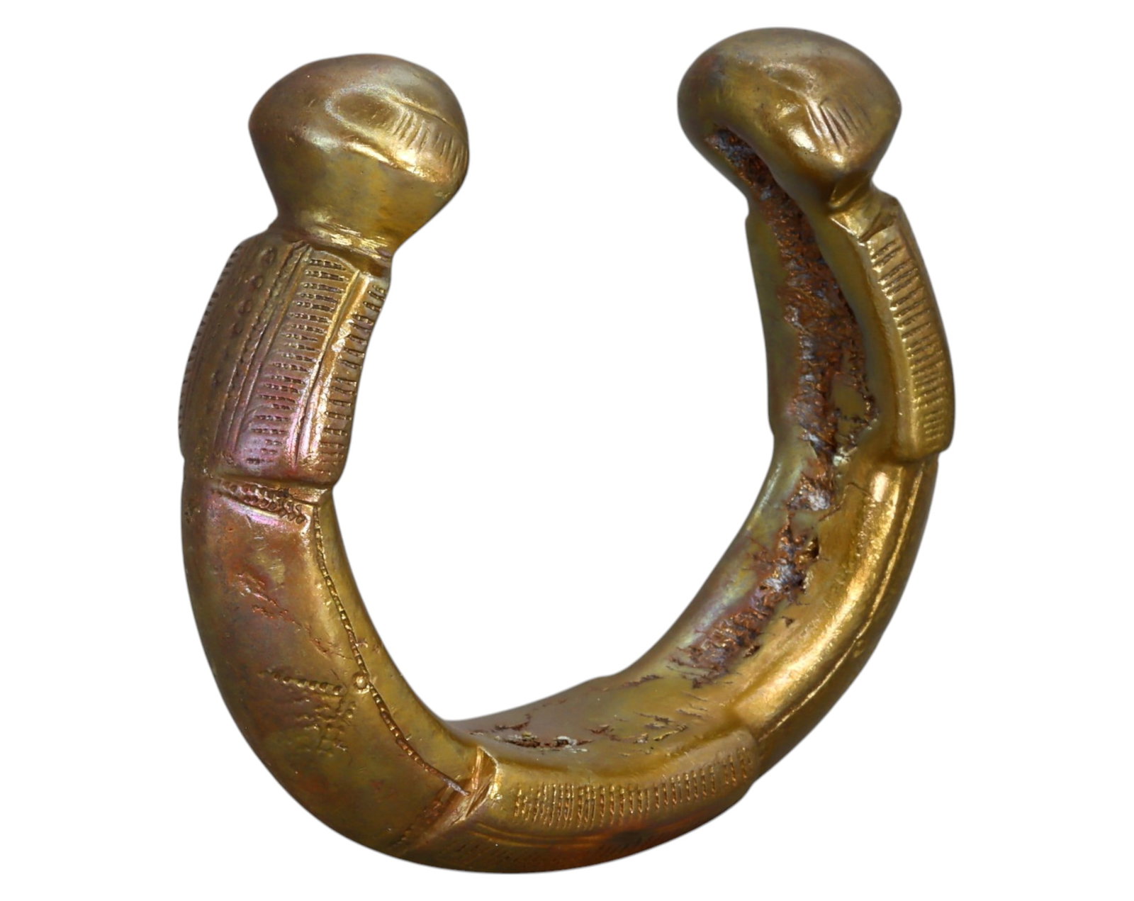 NIGERIA: King Manilla - Forged Bronze, Heavyweight Trade & Prestige Currency, 19th-20th Century: A robust and heavily ornamented King Manilla, measuring 8 x 2 cm and weighing 342g. This forged bronze example features a rounded crescent shape with thick, flared feet, adorned with punched dot-in-ci