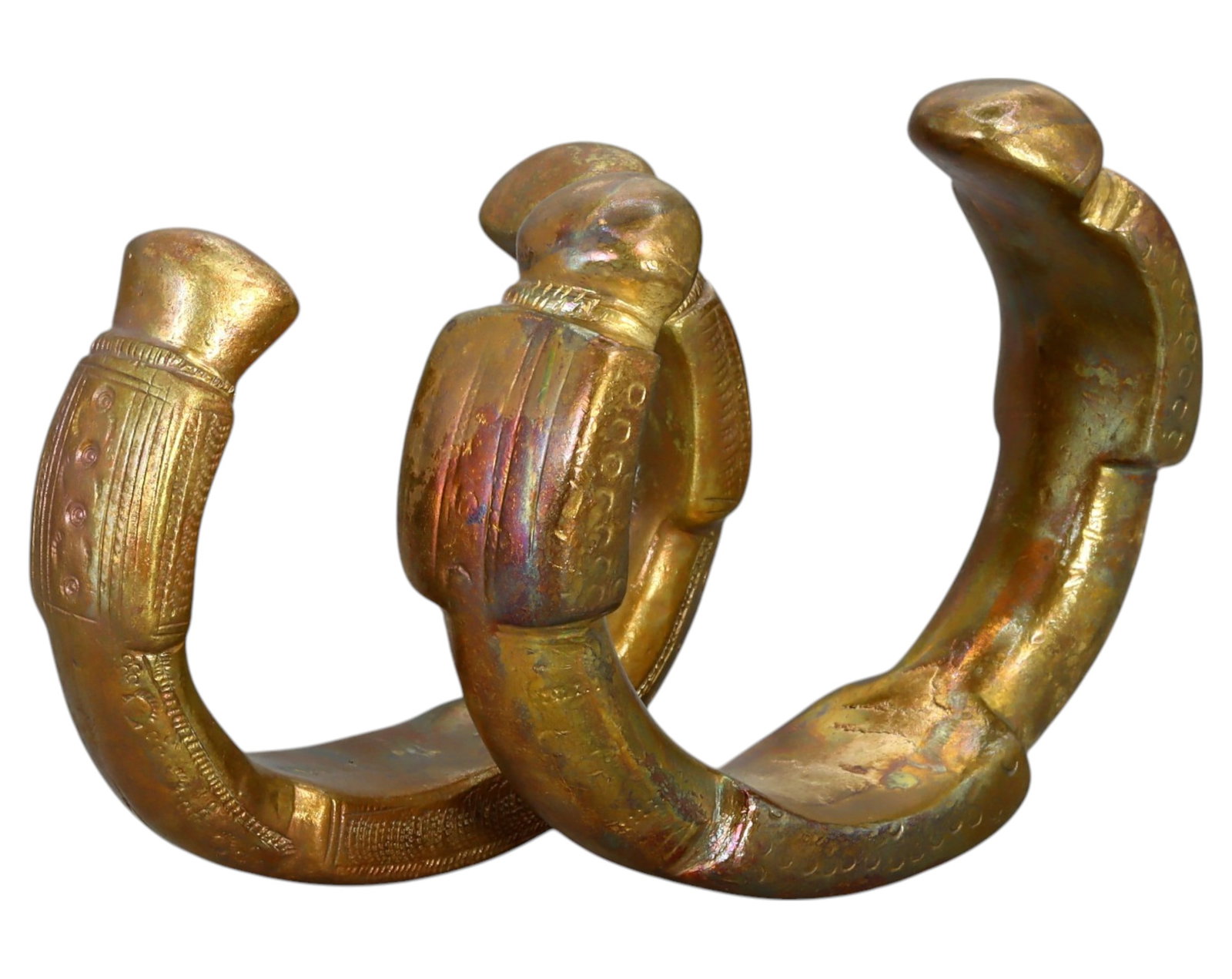 NIGERIA: Pair of King Manillas - Heavy Bronze Prestige Currency, 19th-20th Century: A matched pair of King Manillas, cast in bronze, measuring 8-9 cm in diameter and weighing a combined 665g. These substantial pieces feature bold, crescent-shaped bodies with thick, flared terminals, 