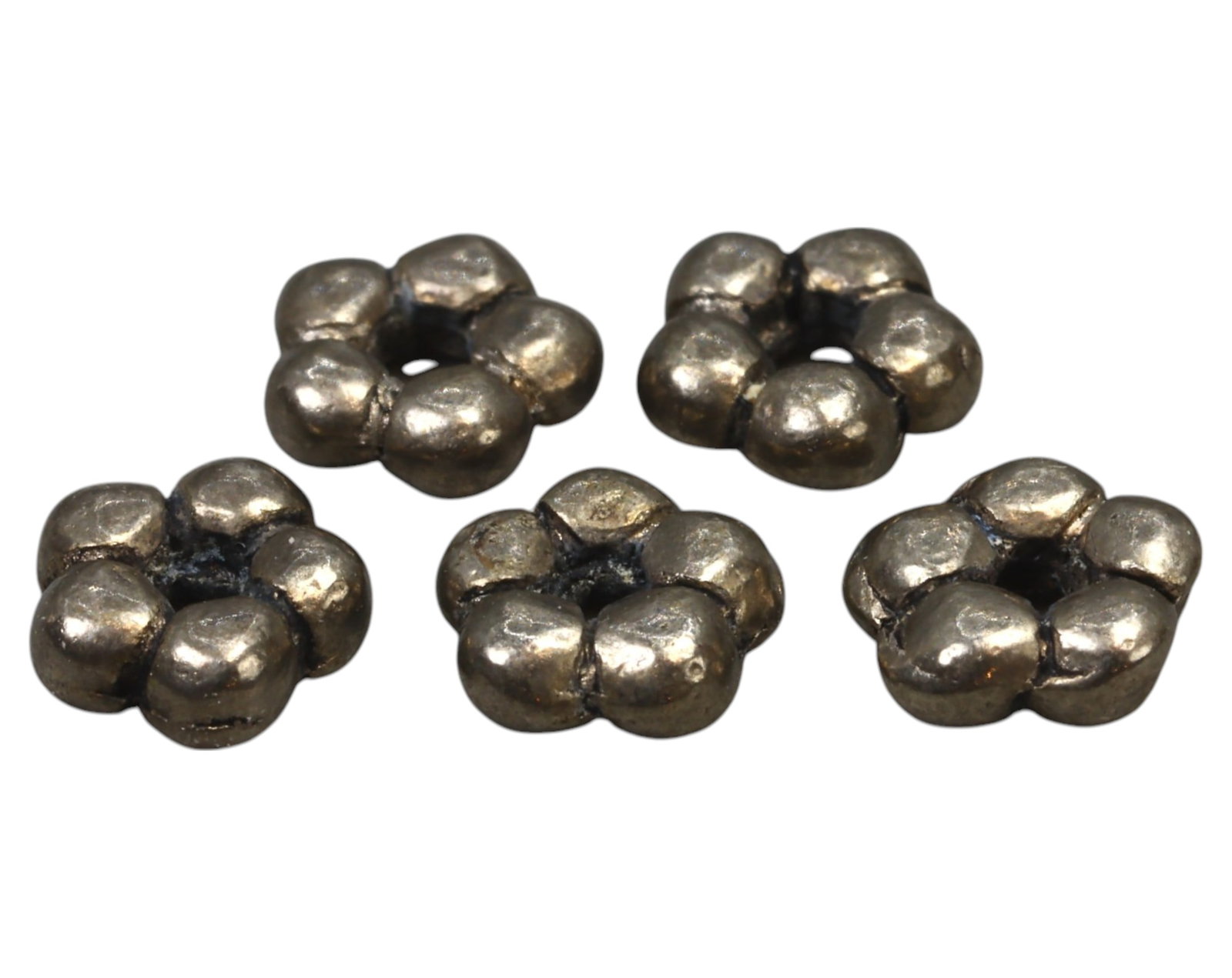 VIKING: Hacksilver Beads - Silver, 5mm, 5 Pieces, c. 9th-11th Century: A rare set of five Viking-era hacksilver beads, each crafted in a distinctive floral or clustered granule design. These small yet significant silver adornments were likely repurposed from larger jewel