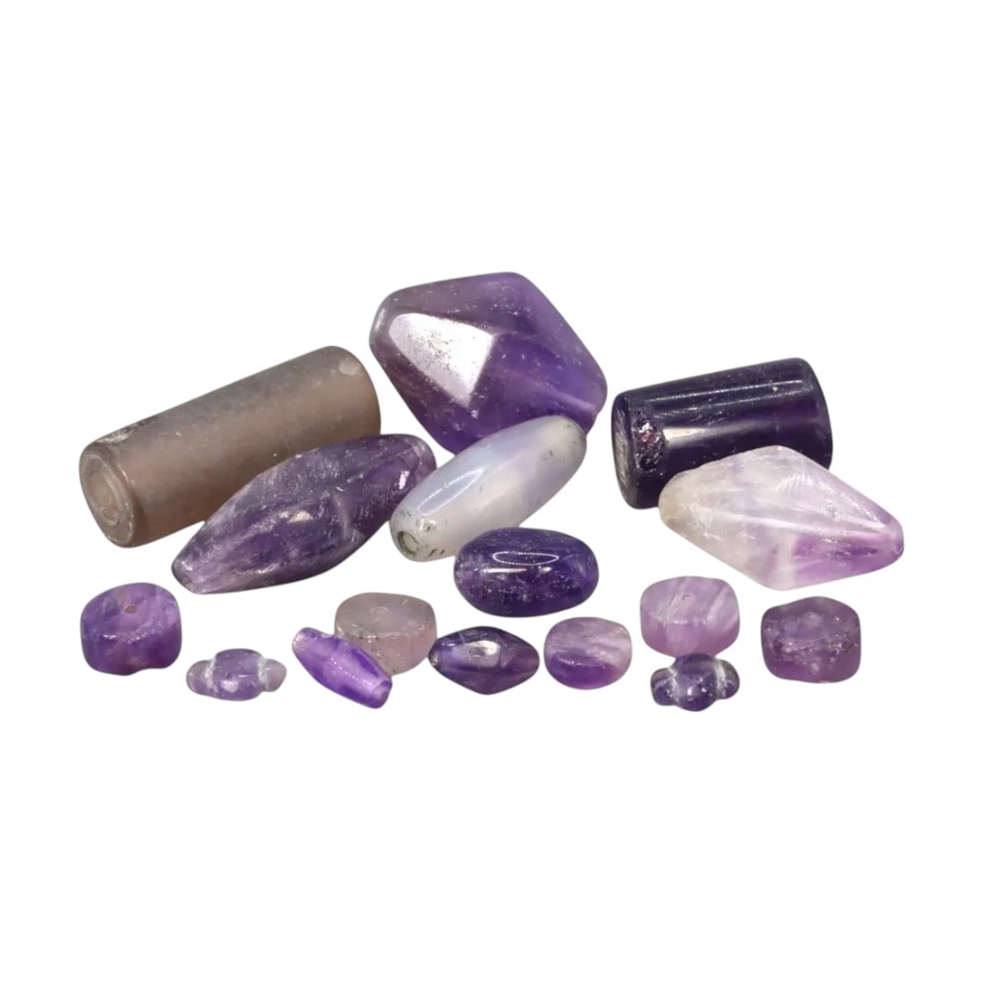 ANTIQUE AMETHYST BEADS: Hand-Cut Collection (42g, 7 - 29mm, Lot of 16): This stunning lot of 16 antique amethyst beads showcases an array of shapes and cuts, ranging from cylindrical and faceted to organic forms. The vibrant hues of purple, complemented by natural inclusi