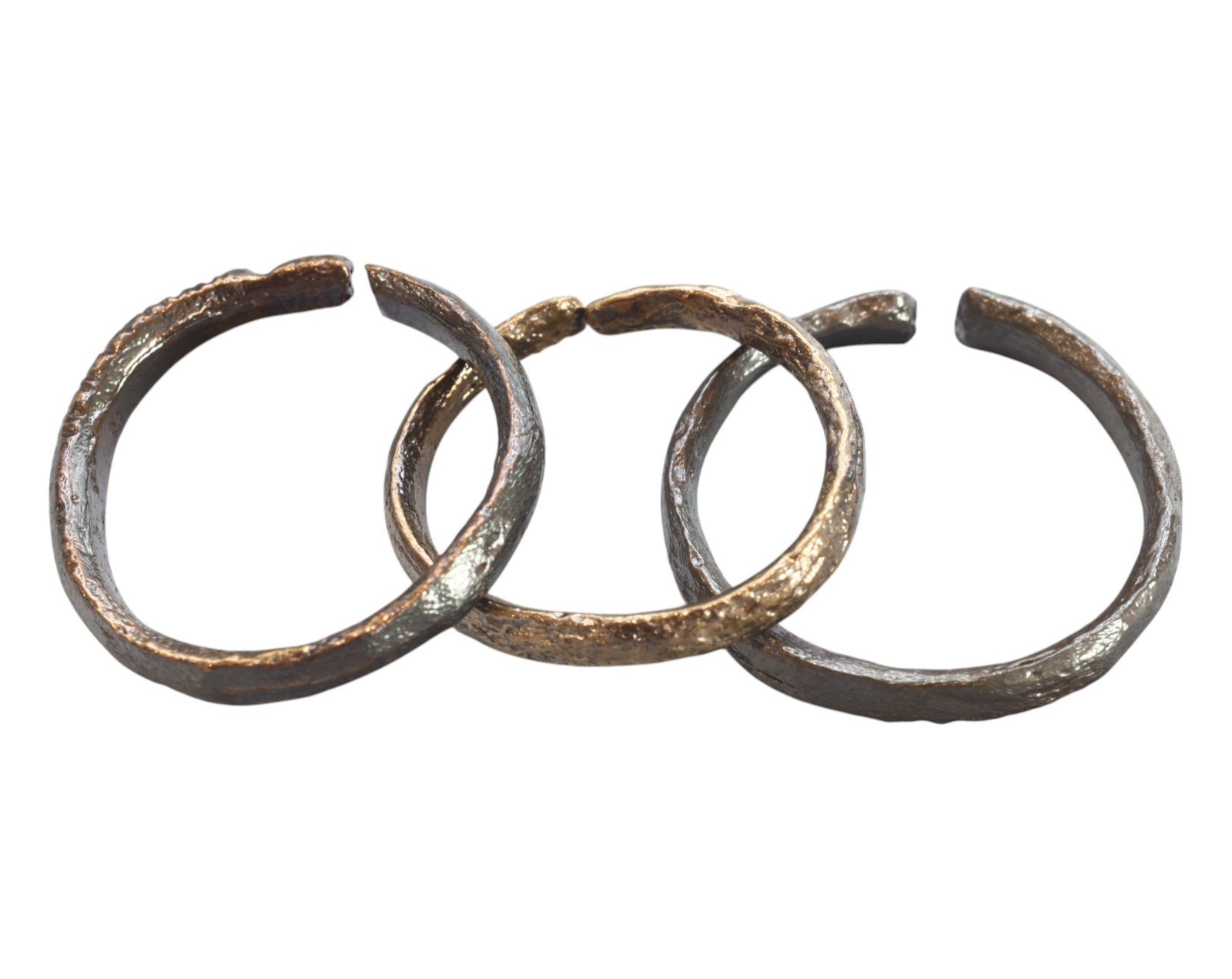 CELTIC PROTO-RING CURRENCY - Bronze, 3 Pieces, 2.5-2.6cm, 13g: A trio of ancient-style Celtic proto-ring currency pieces, each measuring 2.8-3.1 cm in diameter and collectively weighing 54g. These distinctive open-ended bronze rings, exhibiting a rich patina and 