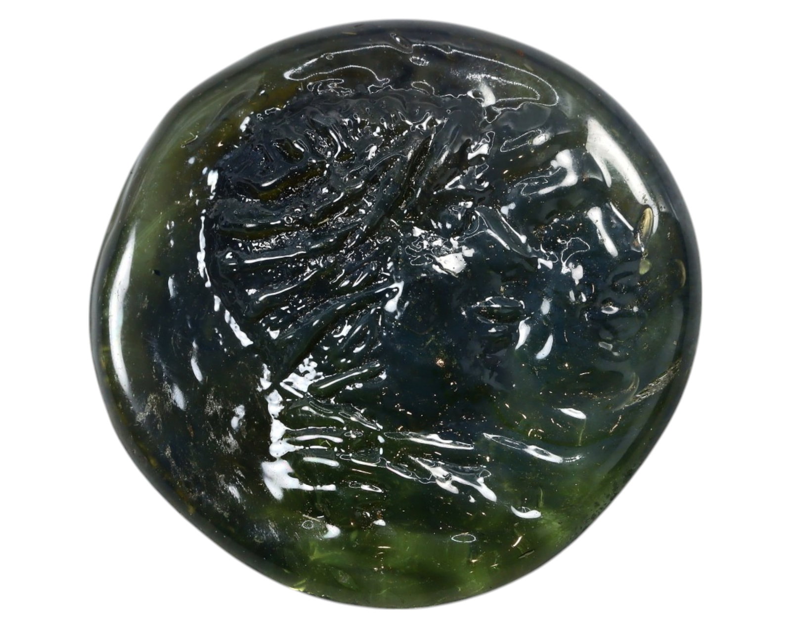 ANCIENT GLASS INTAGLIO - Portrait Motif, 2.5cm, 8g: A finely preserved ancient glass intaglio, measuring 2.5 cm in diameter and weighing 8g. This translucent, deep green artifact bears an intricately carved portrait, possibly depicting a Hellenistic or