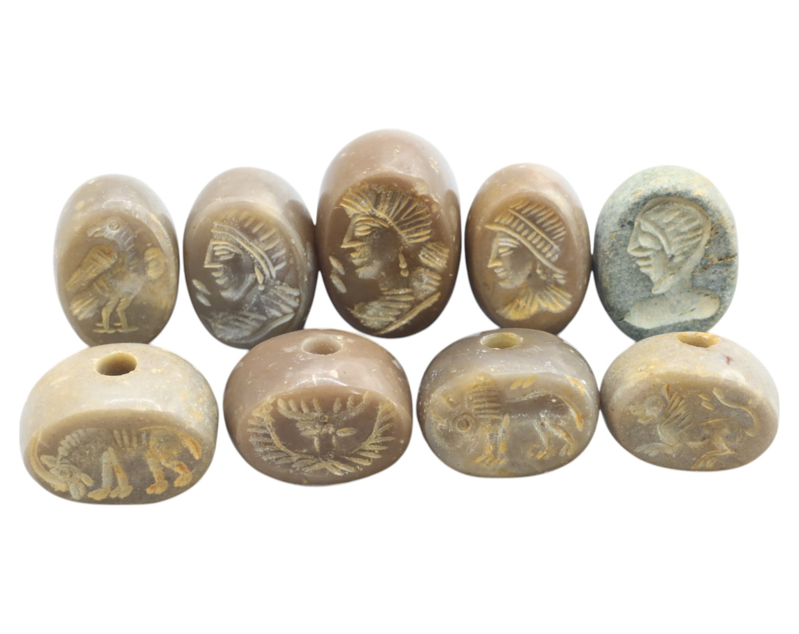 MIDDLE EAST / SOUTH PACIFIC: Intaglio Agate Beads - Set of 10, 19th-20th Century: A fine collection of ten antique intaglio-carved agate beads, averaging 2cm in size and weighing a total of 116g. These expertly engraved beads feature a variety of motifs, including warrior profiles,