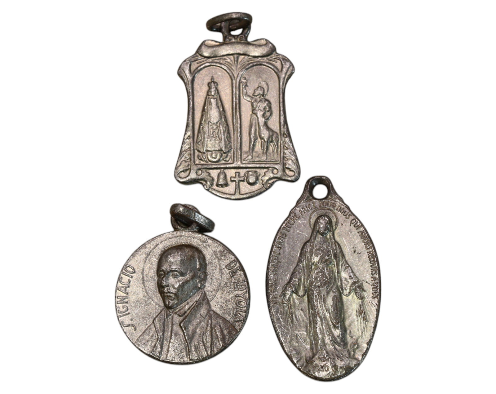 EUROPE: Collection of 3 Silver Religious Medals - 19th to Early 20th Century: This collection of three religious devotional medals, struck in silver or silvered bronze, weighs a total of 6.9g and ranges in size from 1.8cm to 2.5cm. Each medal features finely detailed Christian 
