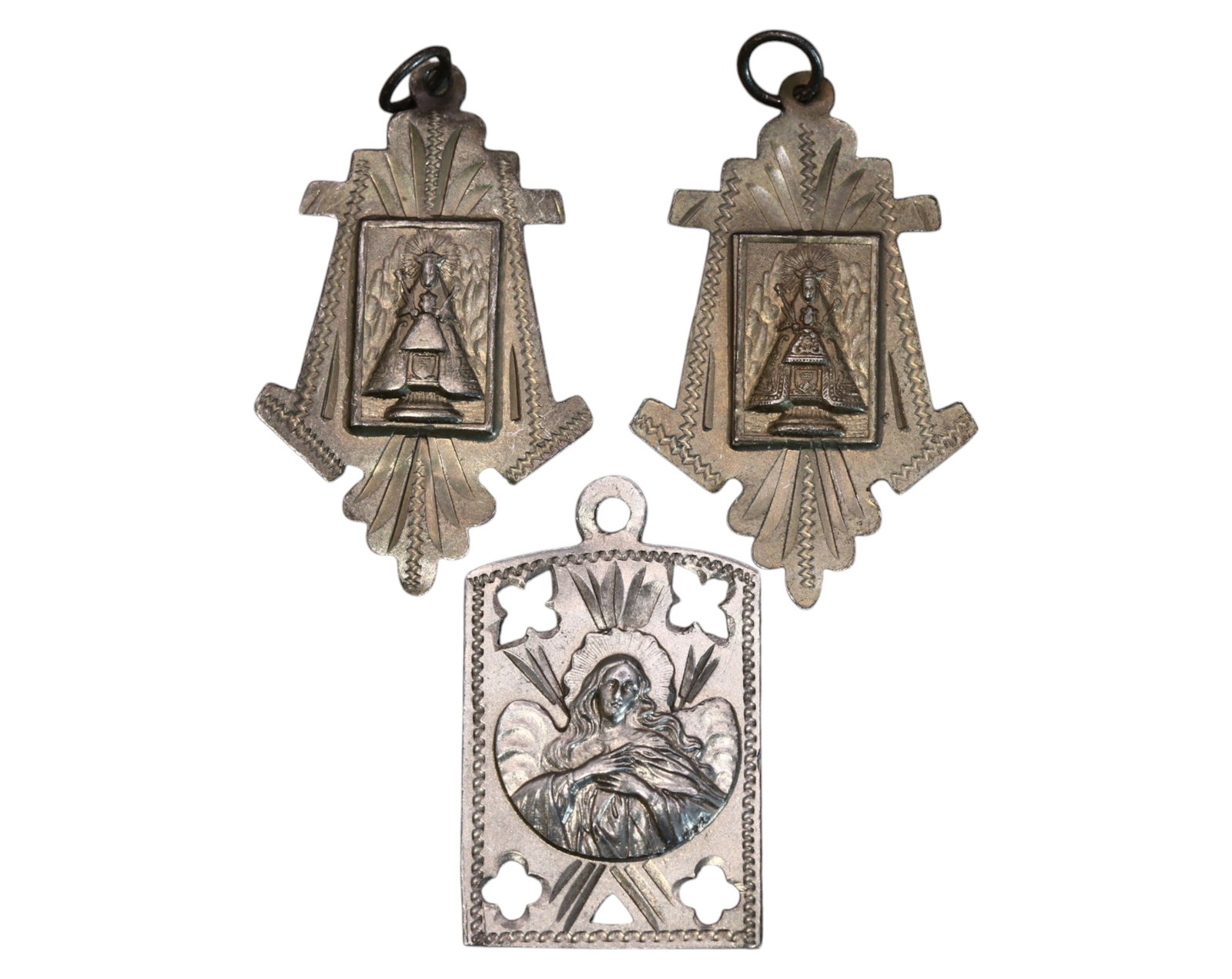 SPAIN: Set of Three Silver Devotional Medals - Virgin of Montserrat, 1919 Engraving: A striking set of three Spanish silver devotional medals, measuring 3 to 3.5 cm with a combined weight of 5.7g. Two medals feature Our Lady of Montserrat, depicted in a distinctive ornate altar-like d