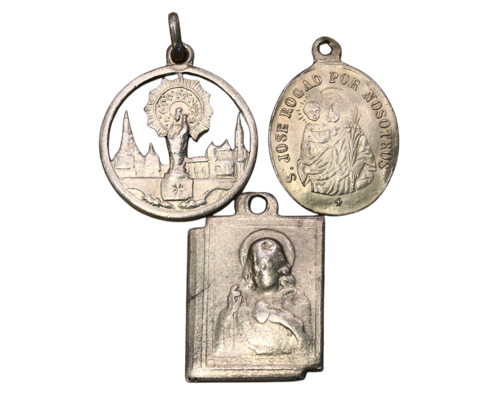 SPAIN: Set of 3 Devotional Medals - Silver, 2.1-2.2cm, 4.8g: A remarkable trio of Spanish religious medals, crafted in silver, measuring 2.1cm to 2.2cm, with a combined weight of 4.8g. Each medal is intricately detailed, featuring revered Catholic figures. One 