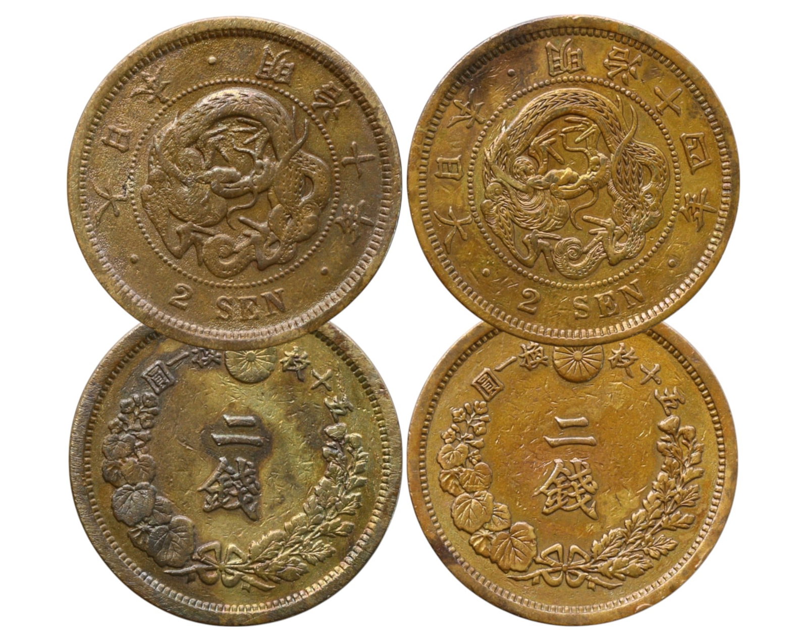 JAPAN: Lot of 2 Bronze 2 Sen Coins - Meiji Era, 1877 & 1881: A pair of Japanese 2 Sen bronze coins from the Meiji period, dated Year 10 (1877) and Year 14 (1881). Weighing a combined 28g and measuring 3cm in diameter, these coins showcase the classic imperial d